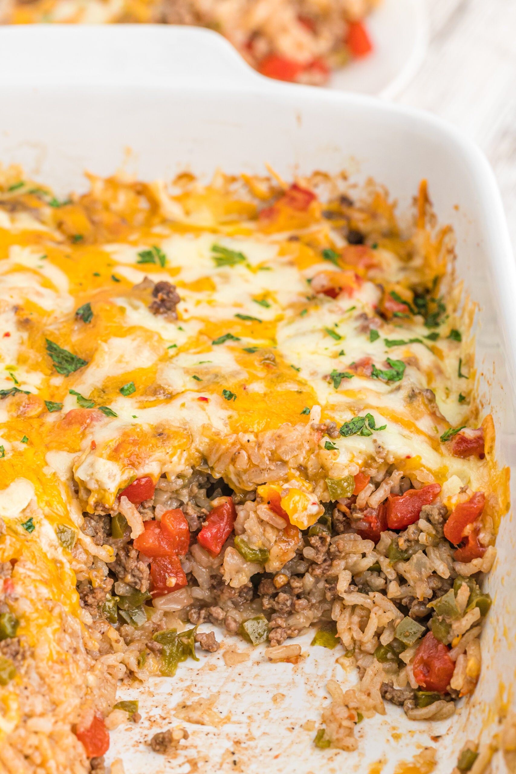Stuffed bell pepper casserole in a white baking dish