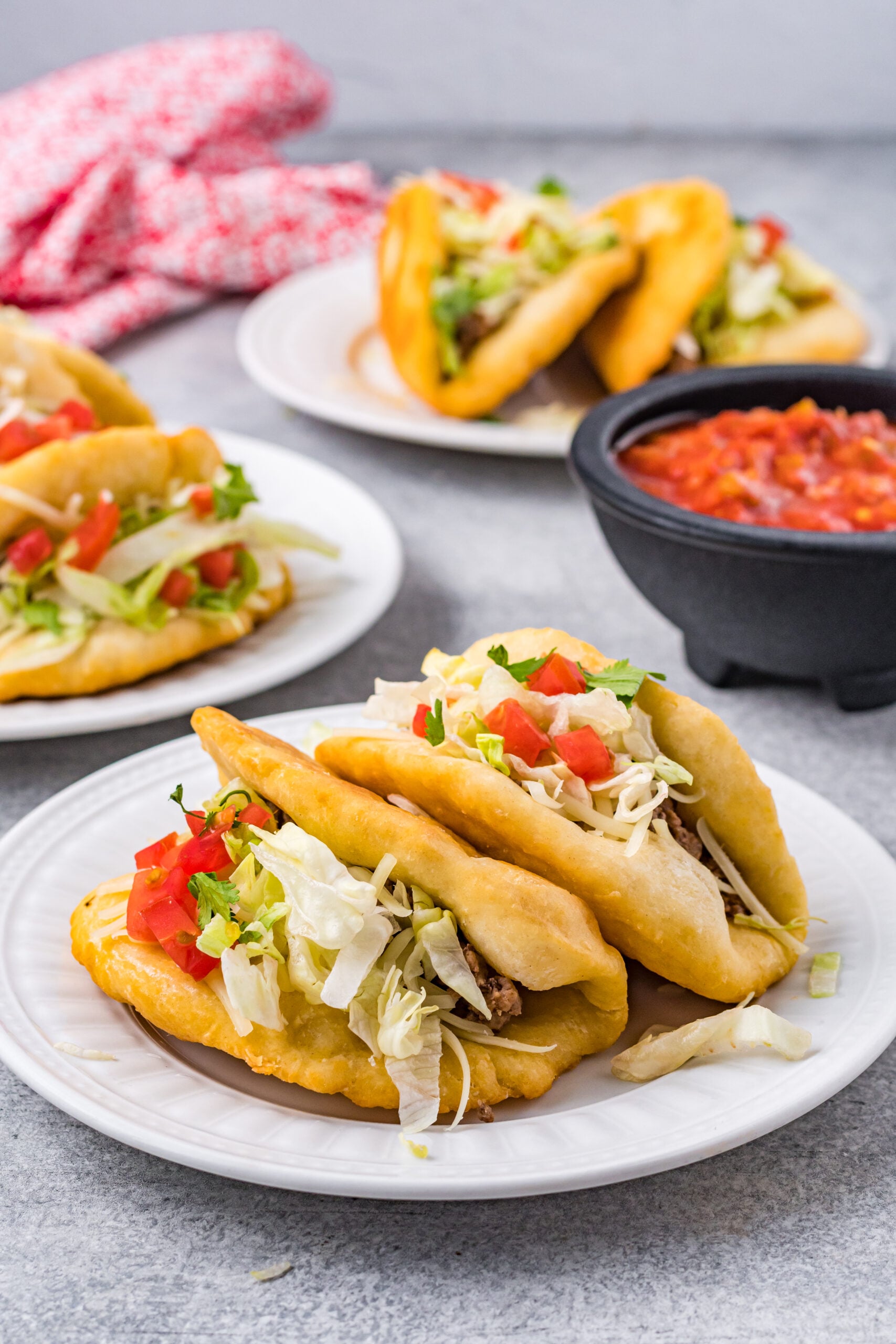 Front view of Taco Bell Chalupas on a white plate.