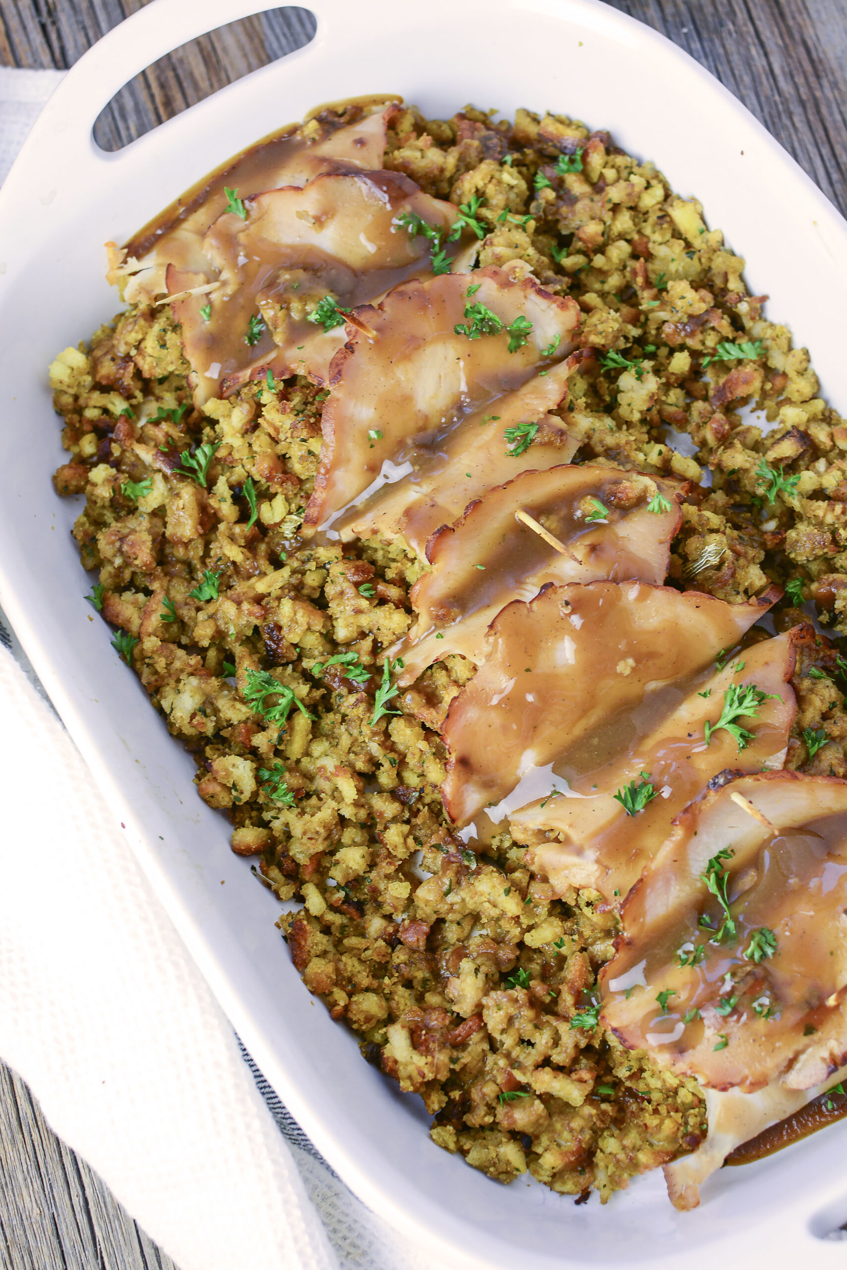 Overhead view of Turkey Stuffing Rolls in a white baking dish. 