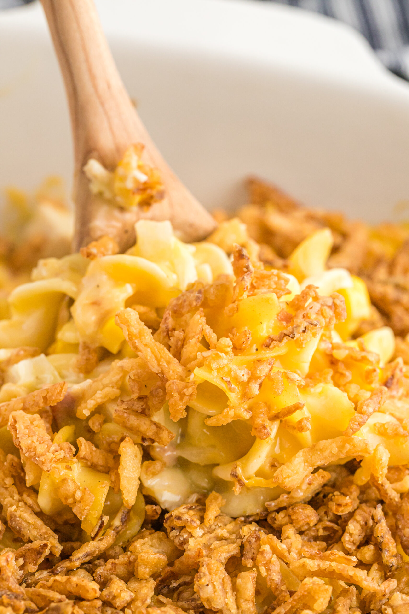 Close up view of Ultimate Chicken Casserole in a white baking dish.