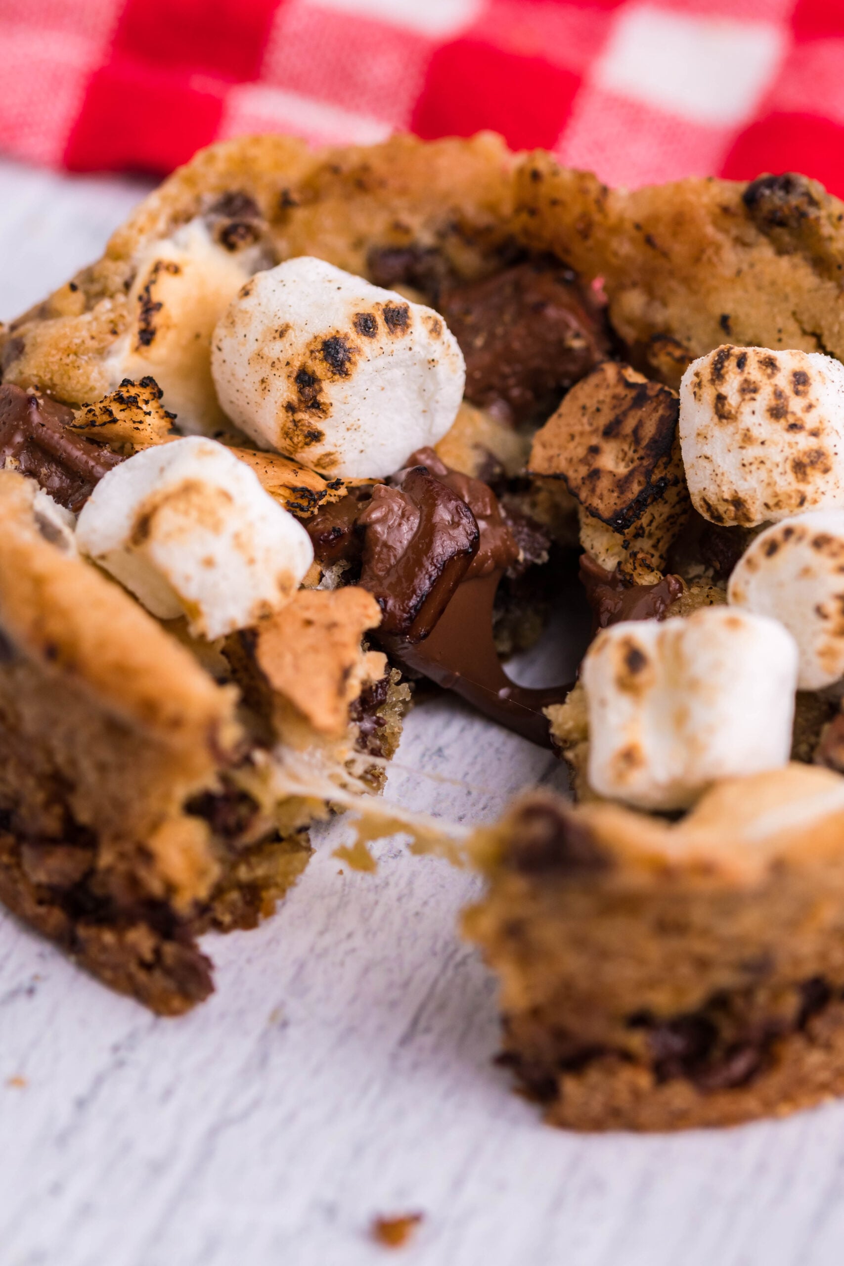Close up view of Deep Dish S’mores Cookies split in half.