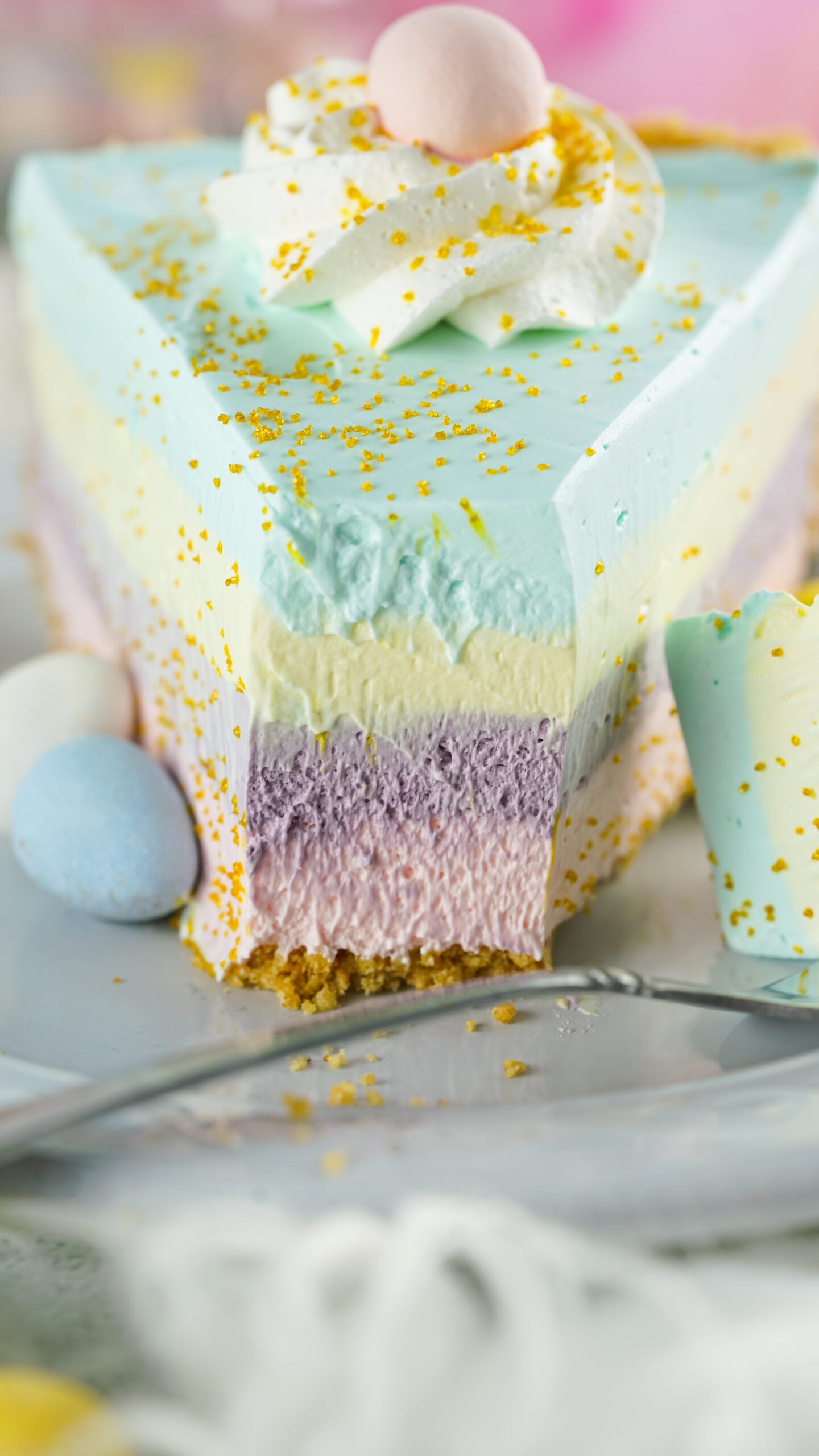 Front view of Easter Kool Aid Pie with a bite removed by a silver fork.