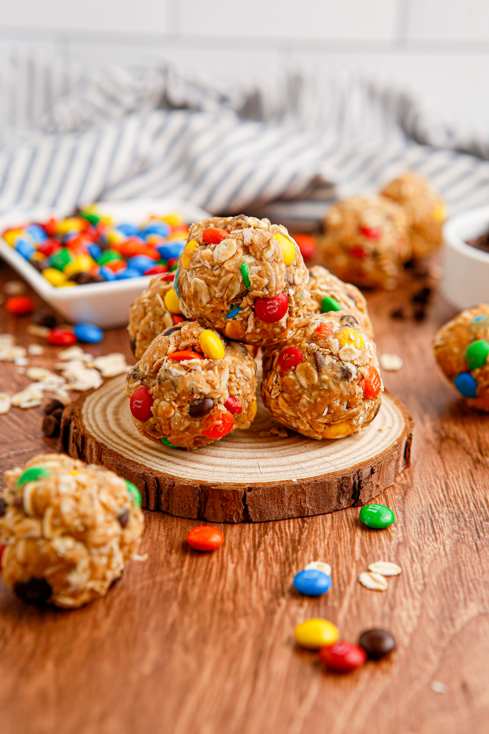 Close up view of No Bake M&M Energy balls on a wooden table