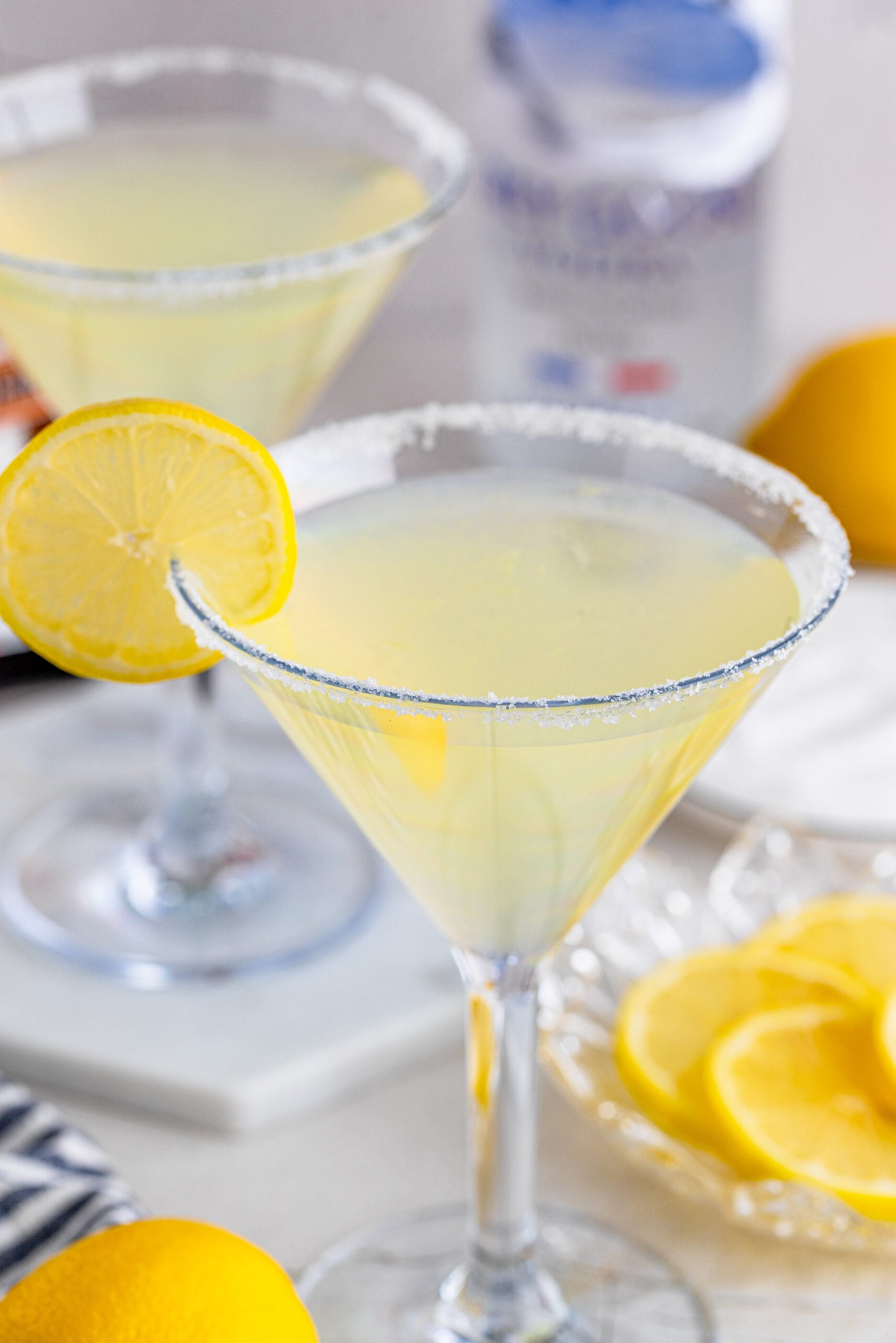 Lemon Drop Martini in a martini glass with a lemon slice. 