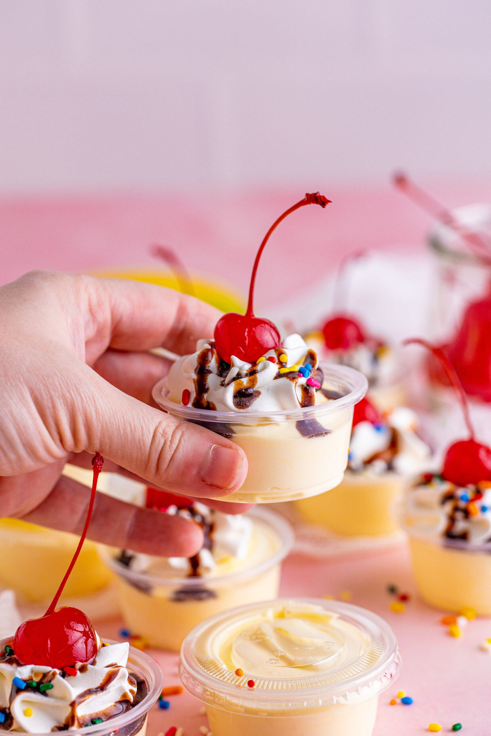 Side view of Banana Split Shots being held.