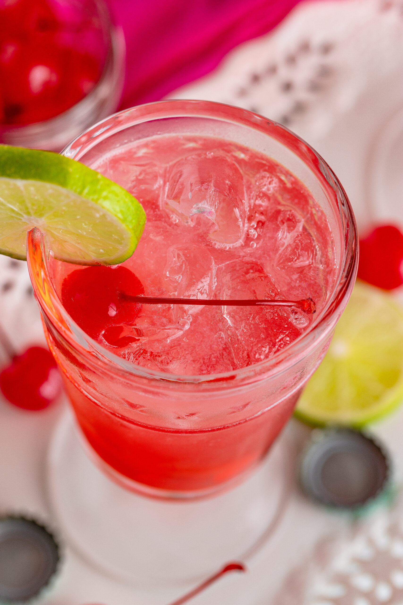 Overhead view of Dirty Shirley Temple garnished with a lime slice.