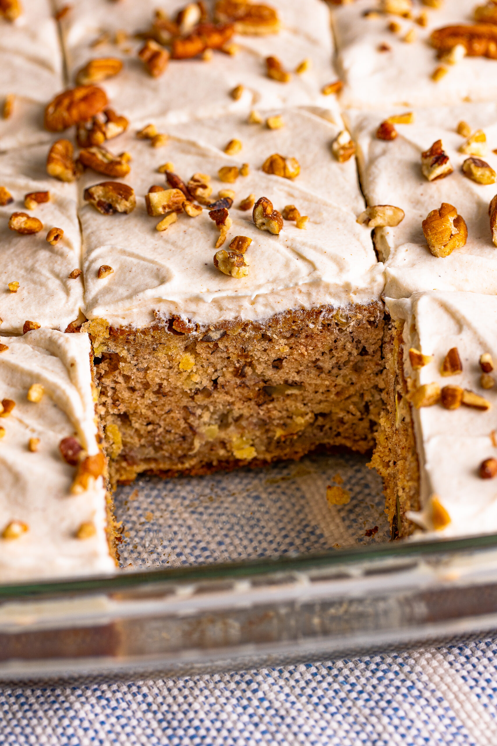Hummingbird Cake in a baking dish with a slice cut out