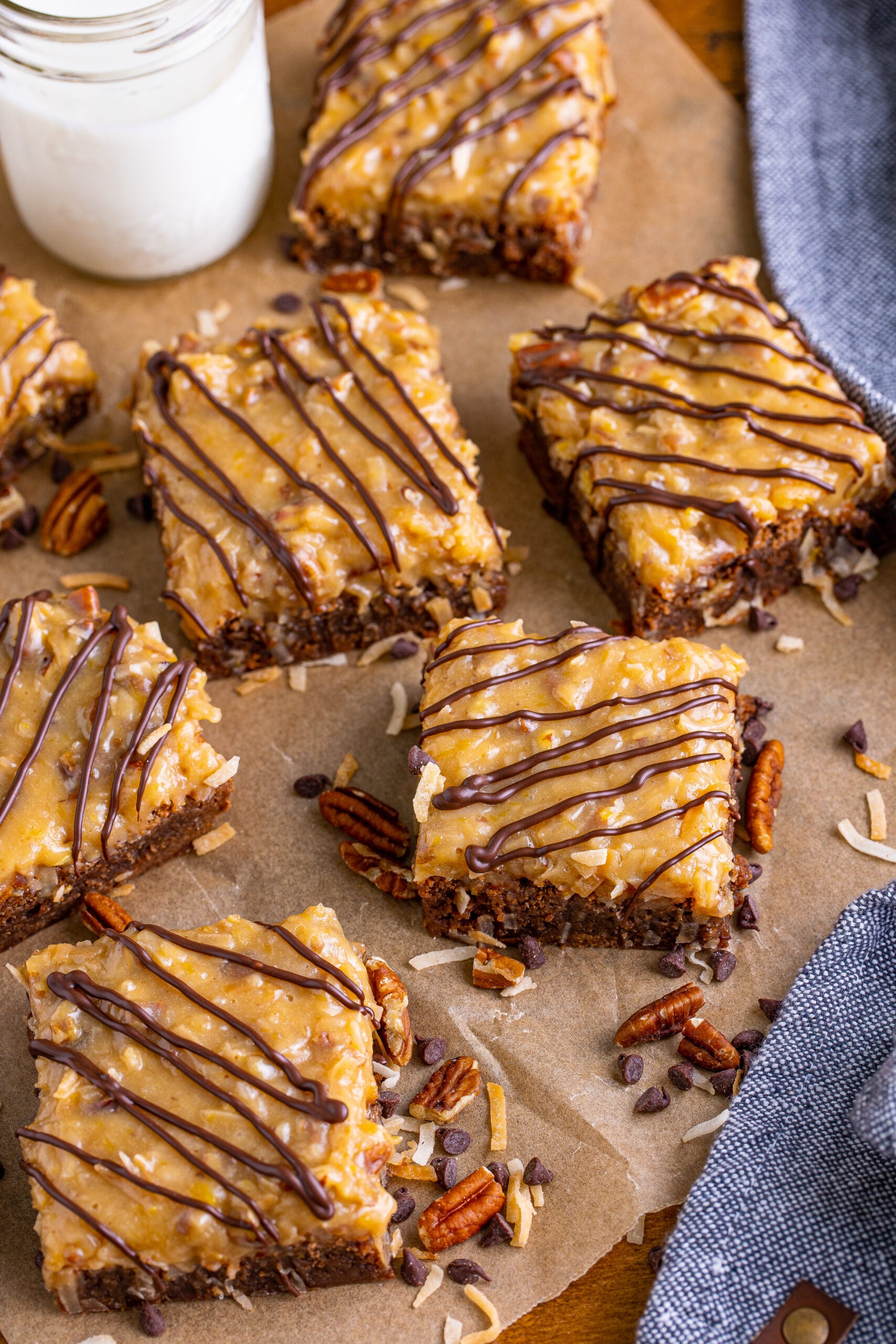 Overhead view of German Chocolate Brownies on a piece of parchment paper.