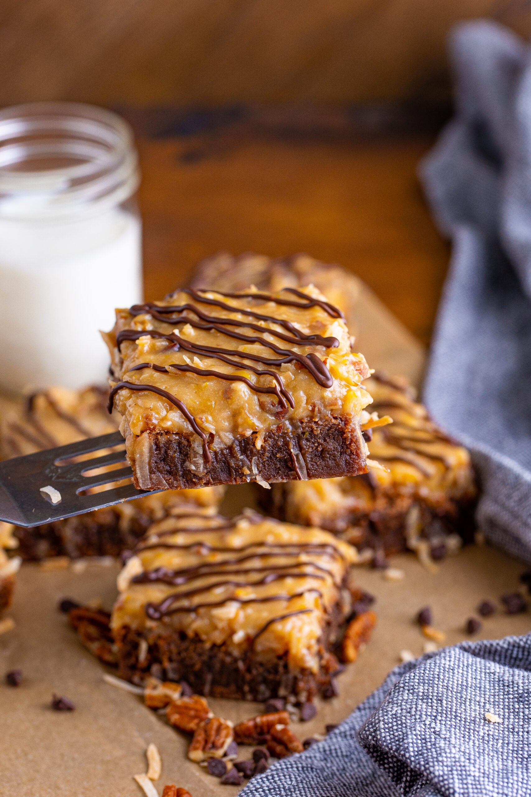 Front view of German Chocolate Brownies on a silver spatula.