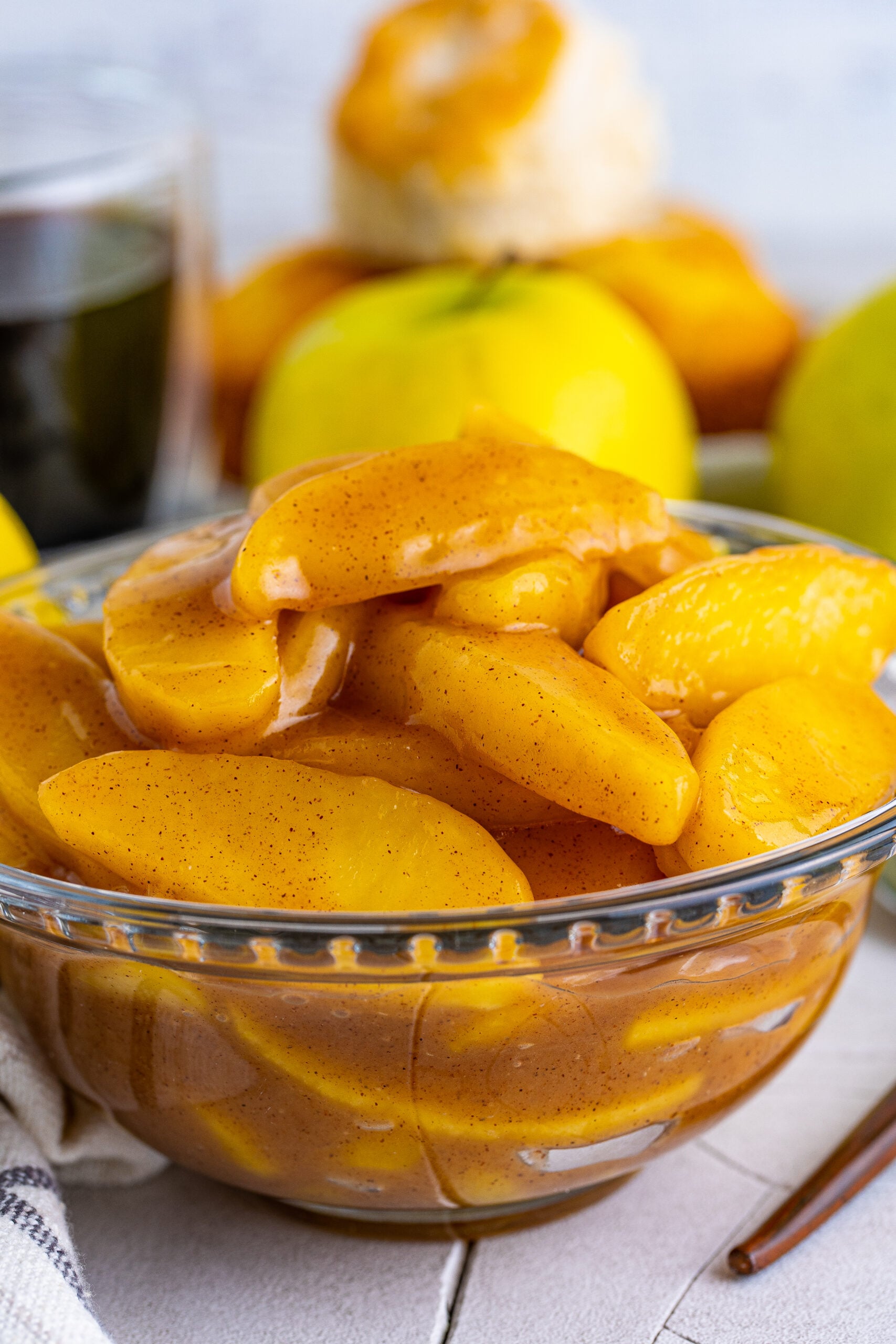 Close up view of Cracker Barrel Fried Apples in a clear glass bowl.