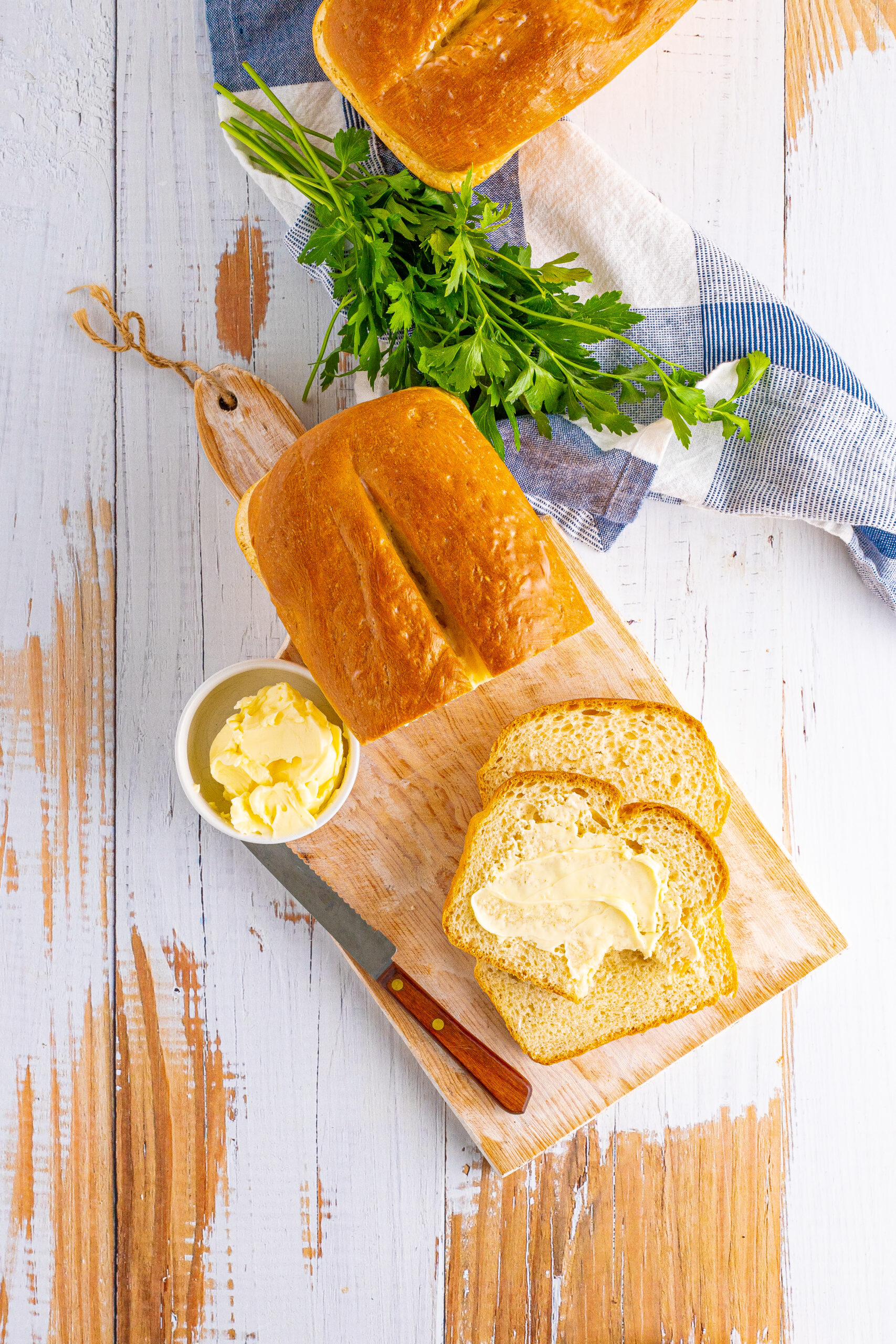 Overhead view of a loaf of White Bread with slices removed.