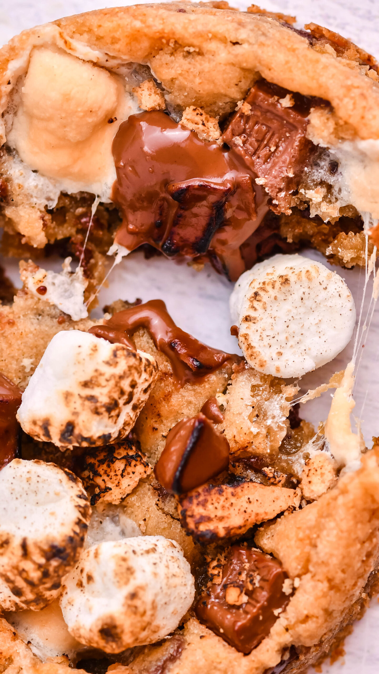 Close up view of Deep Dish S’mores Cookies split in half.