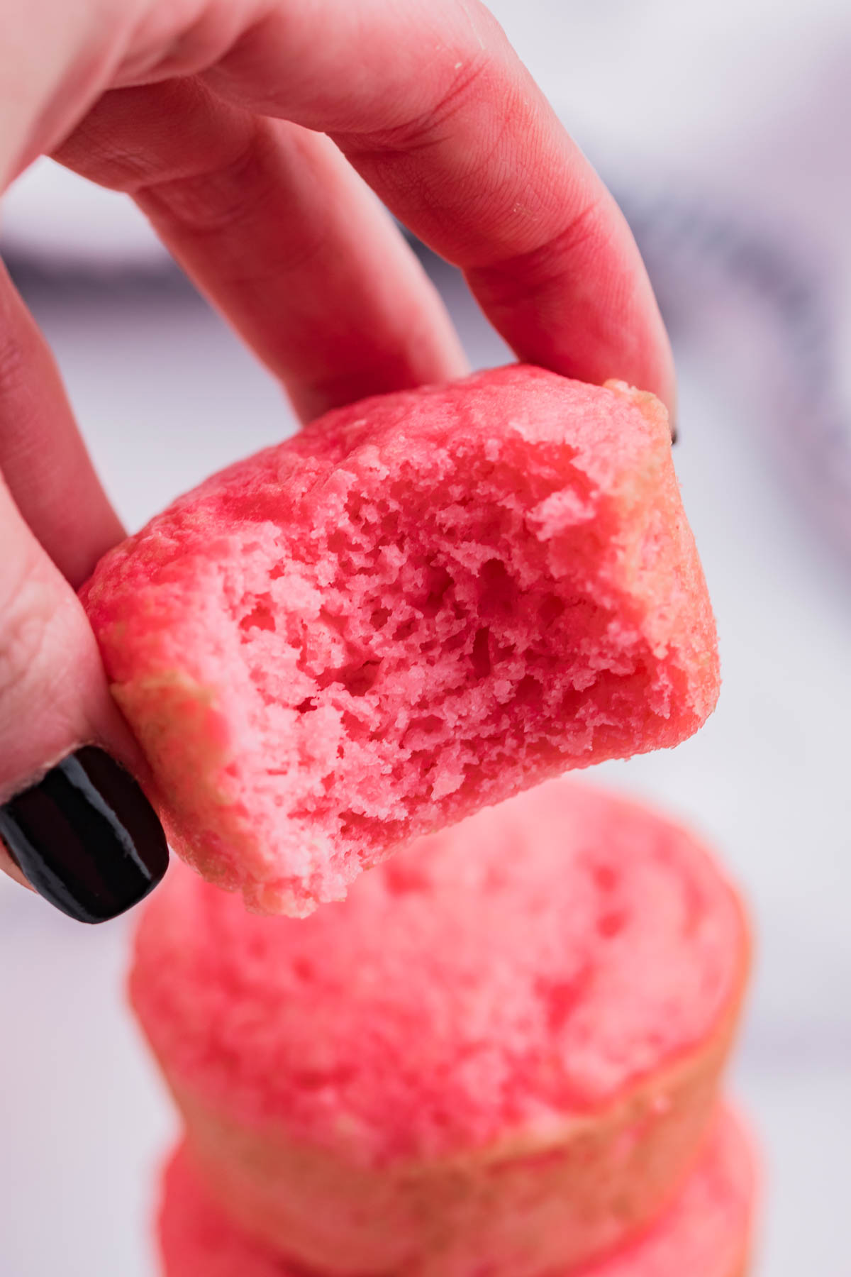Up close view of a Weight Watchers Strawberry Muffin with a bite removed.