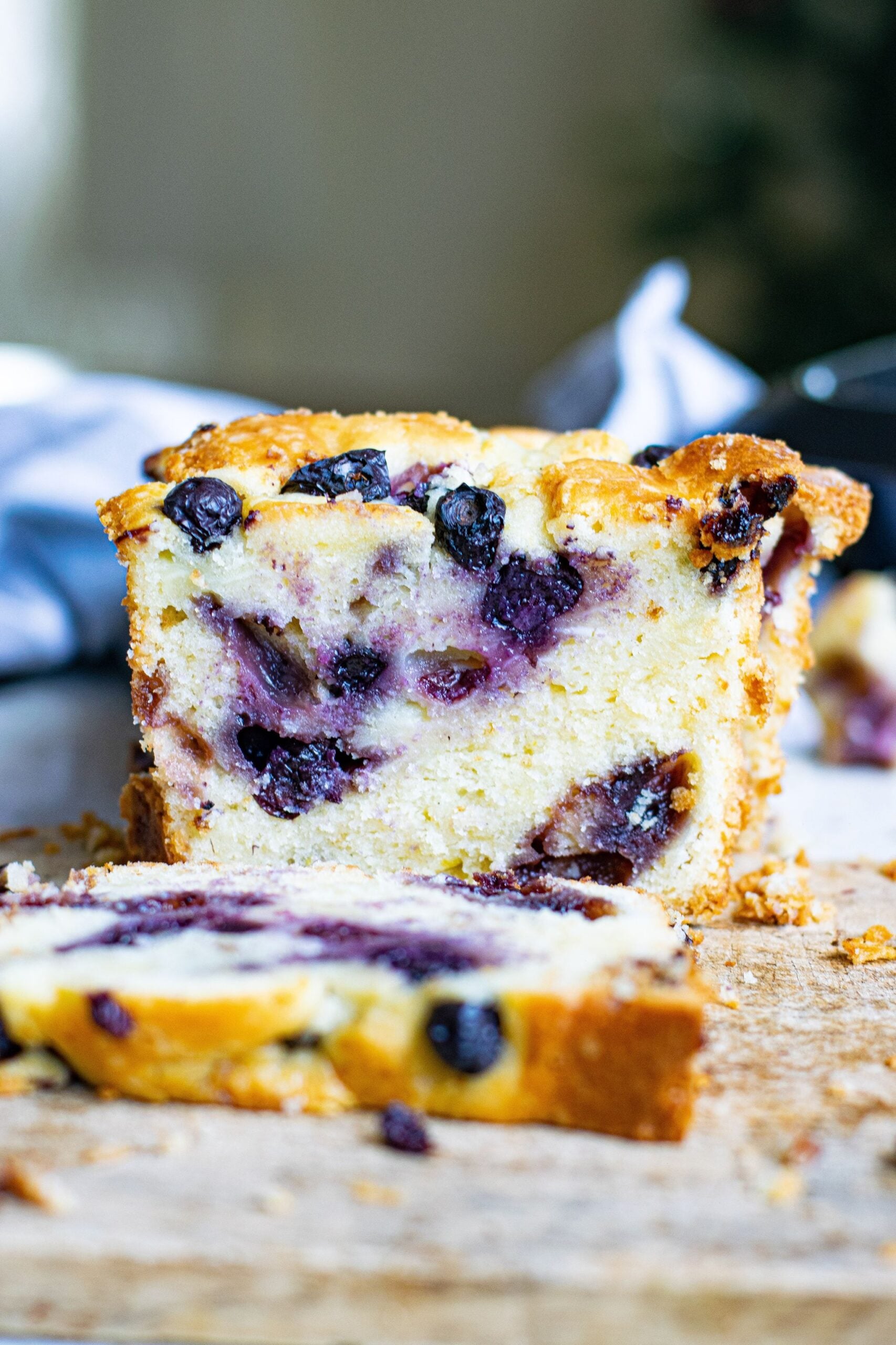 Side view of the cut blueberry cream cheese loaf.