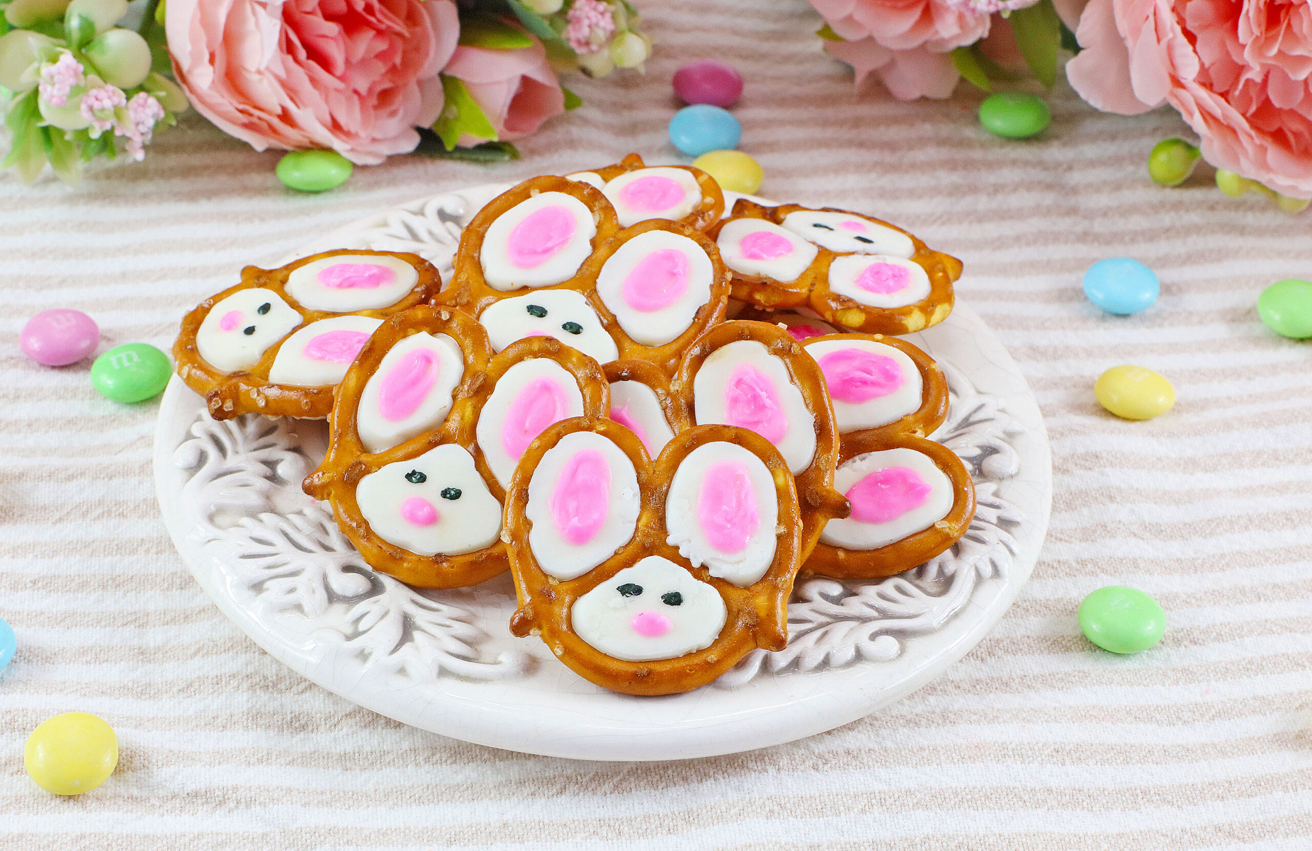 Front view of a pile of Bunny Pretzels on a white dish.