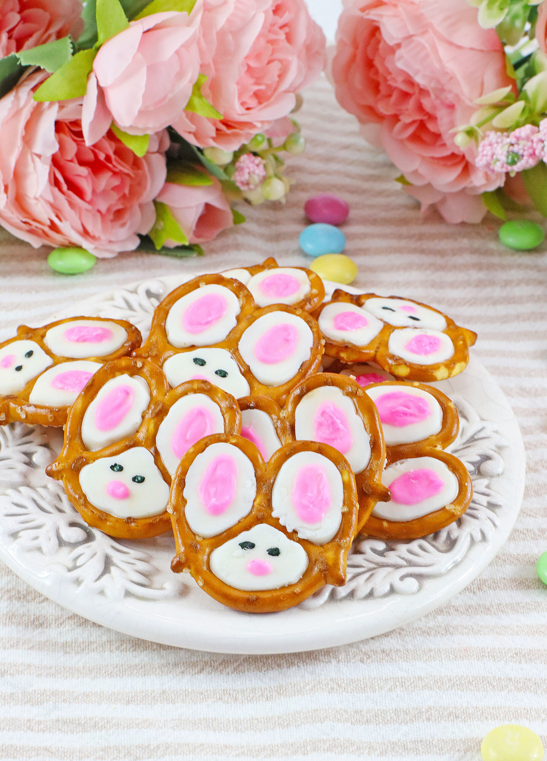 Front view of a pile of Bunny Pretzels on a white dish.