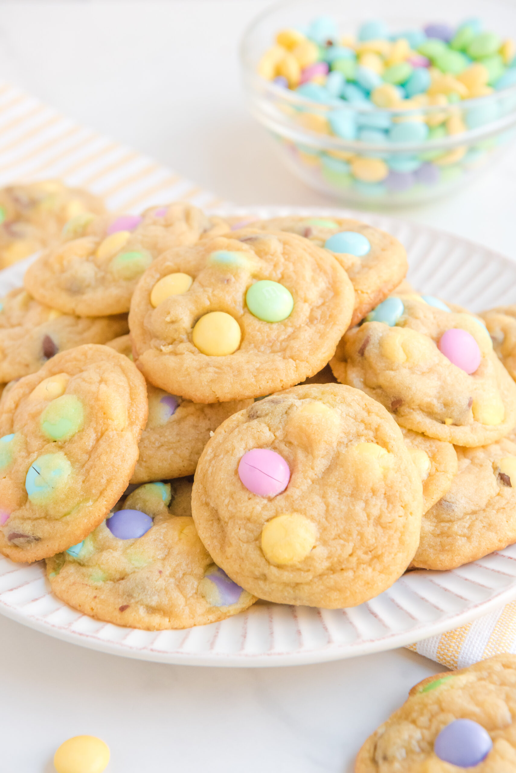 Front view of a stack of Easter Pudding Cookies on a white plate.