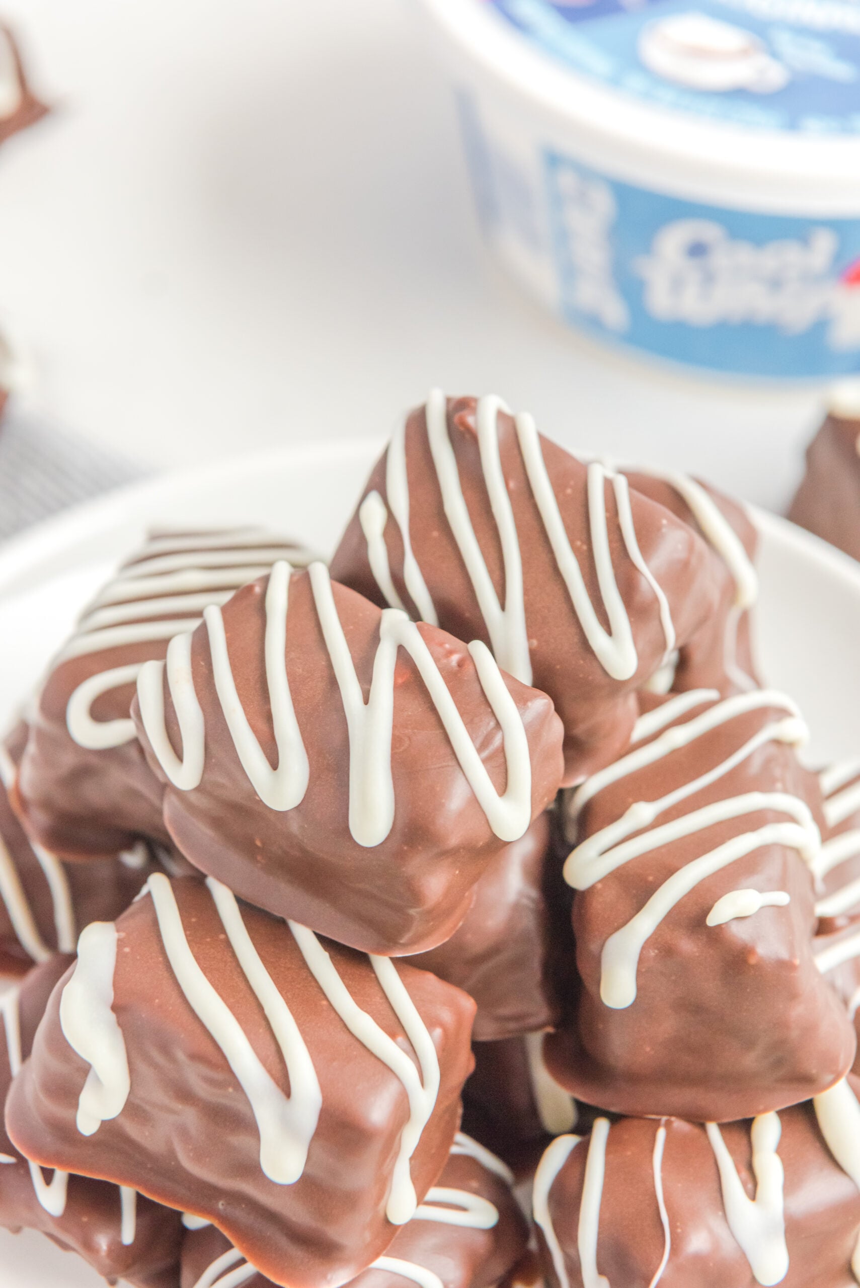 Overhead view of a stack of Cool Whip Candy on a white plate.