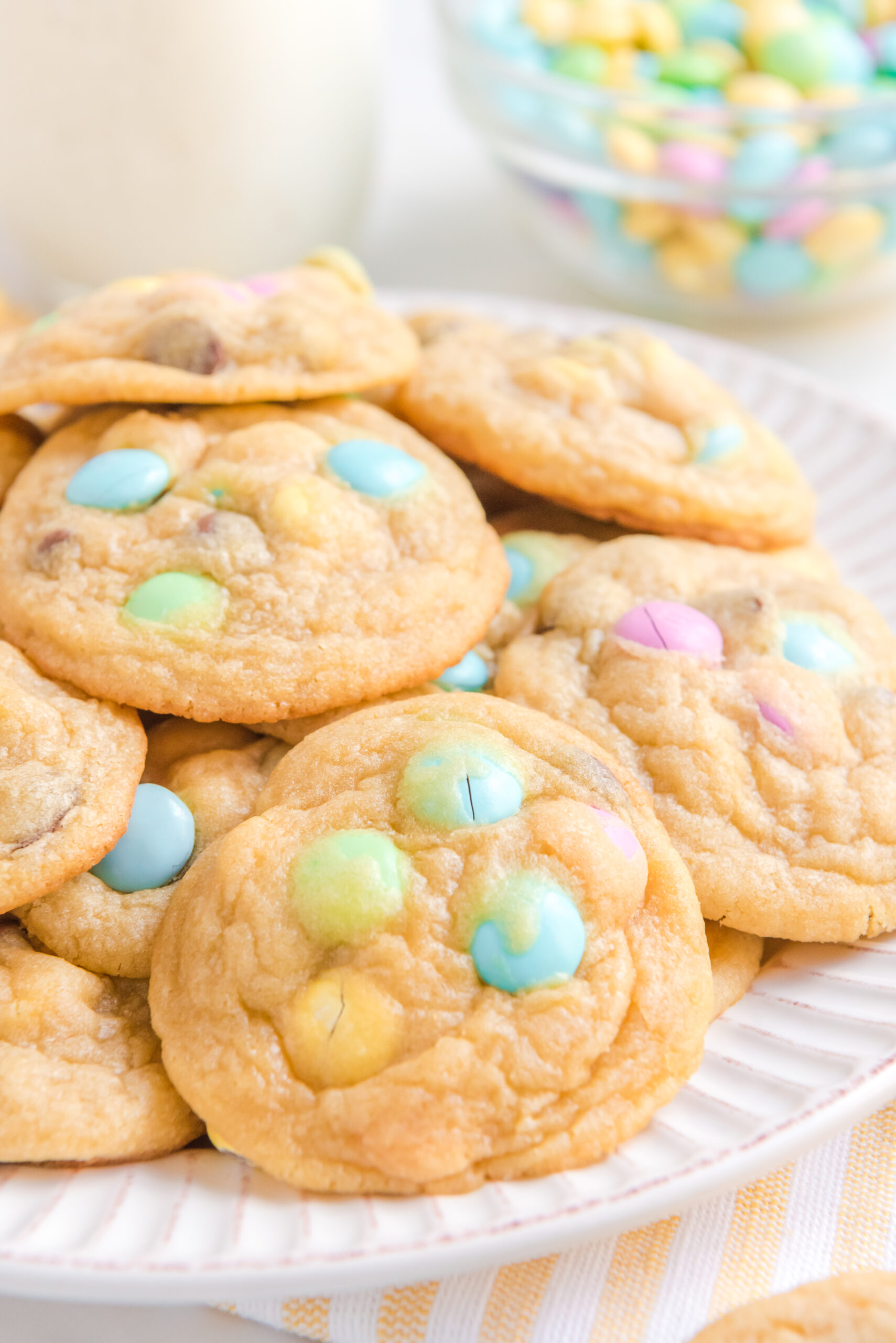 Close up view of a stack of Easter Pudding Cookies on a white plate.