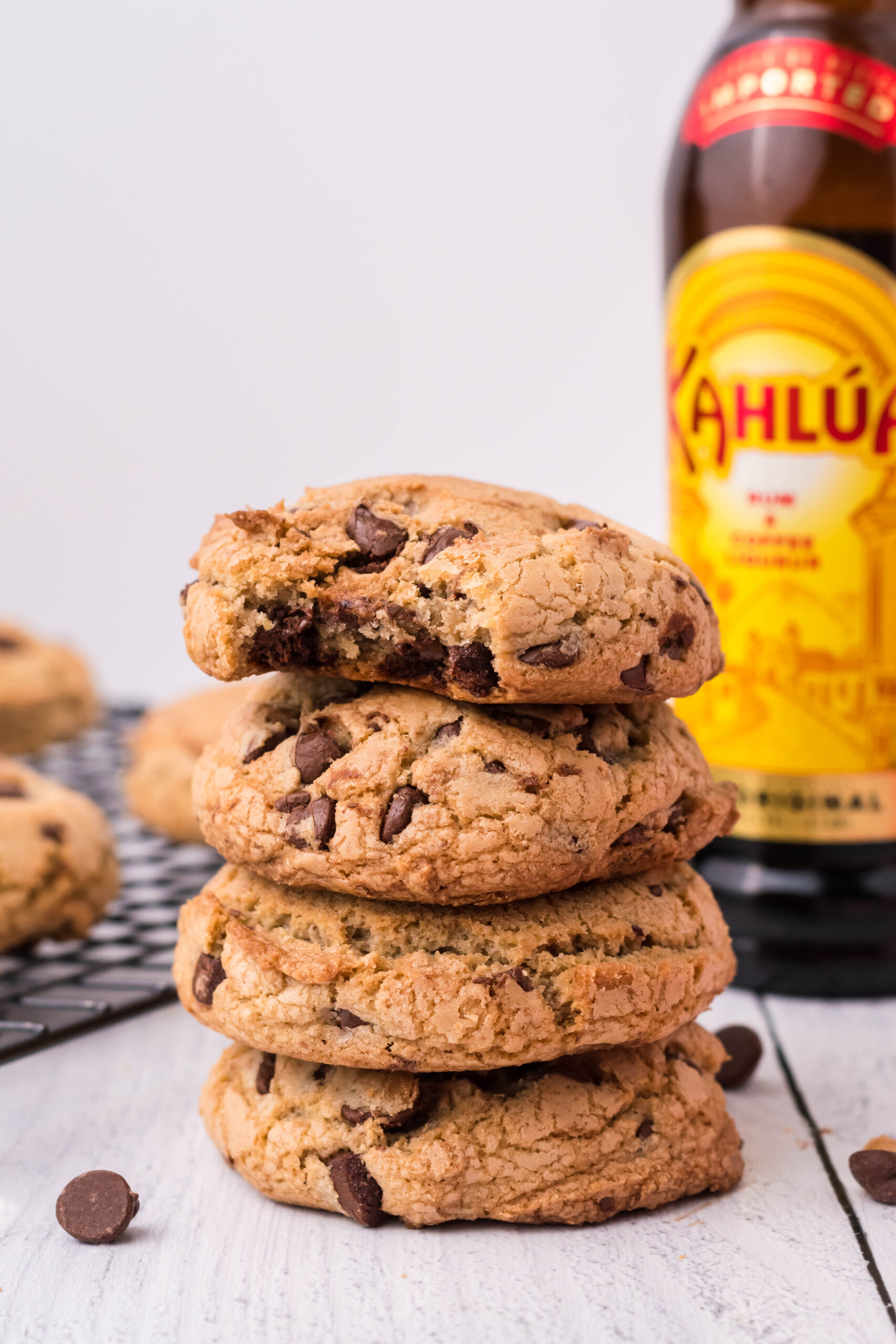 Front view of four Kahlua Cookies stacked with a bite removed from the top cookie.