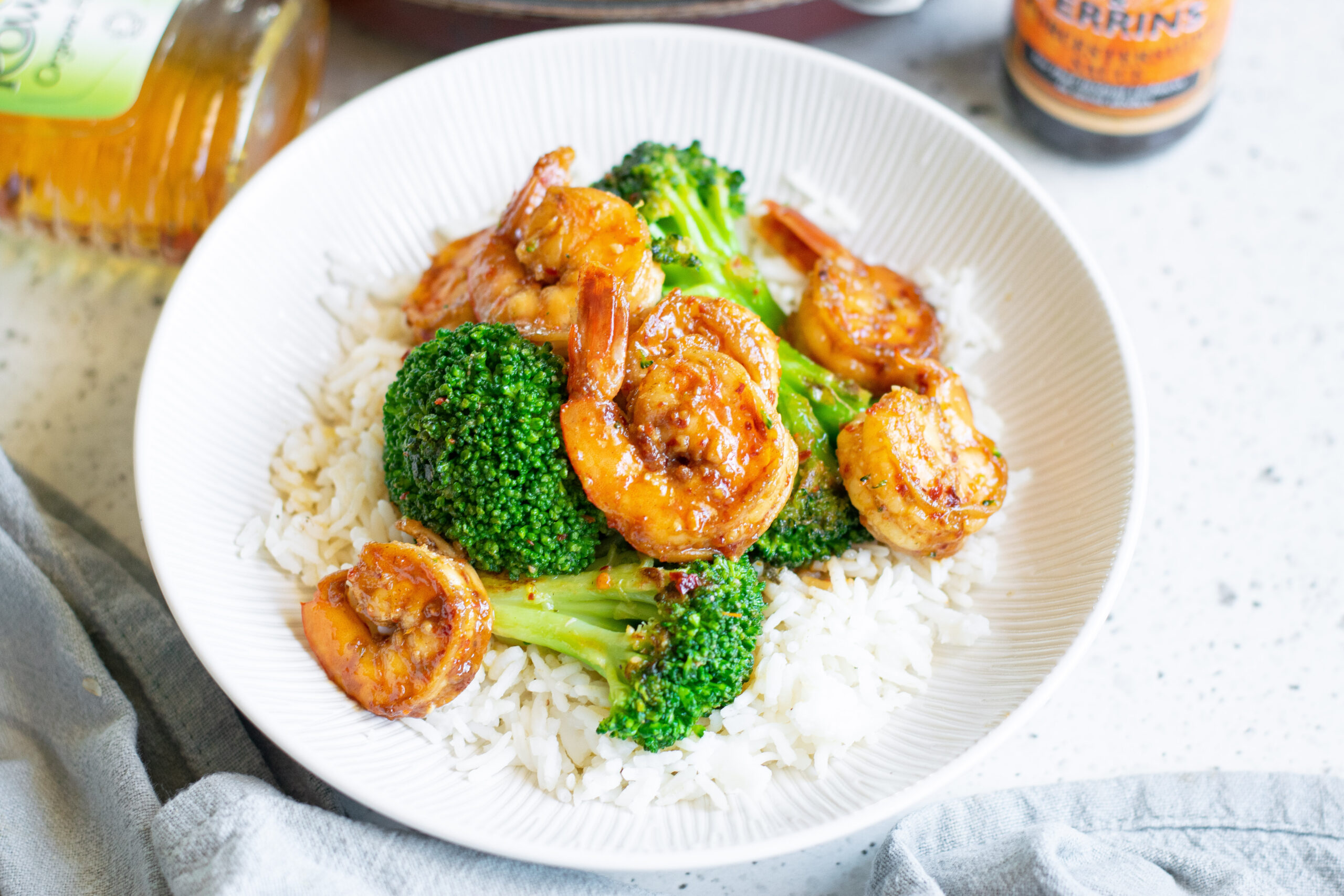 Overhead shot of the shrimp and broccoli plated over rice.