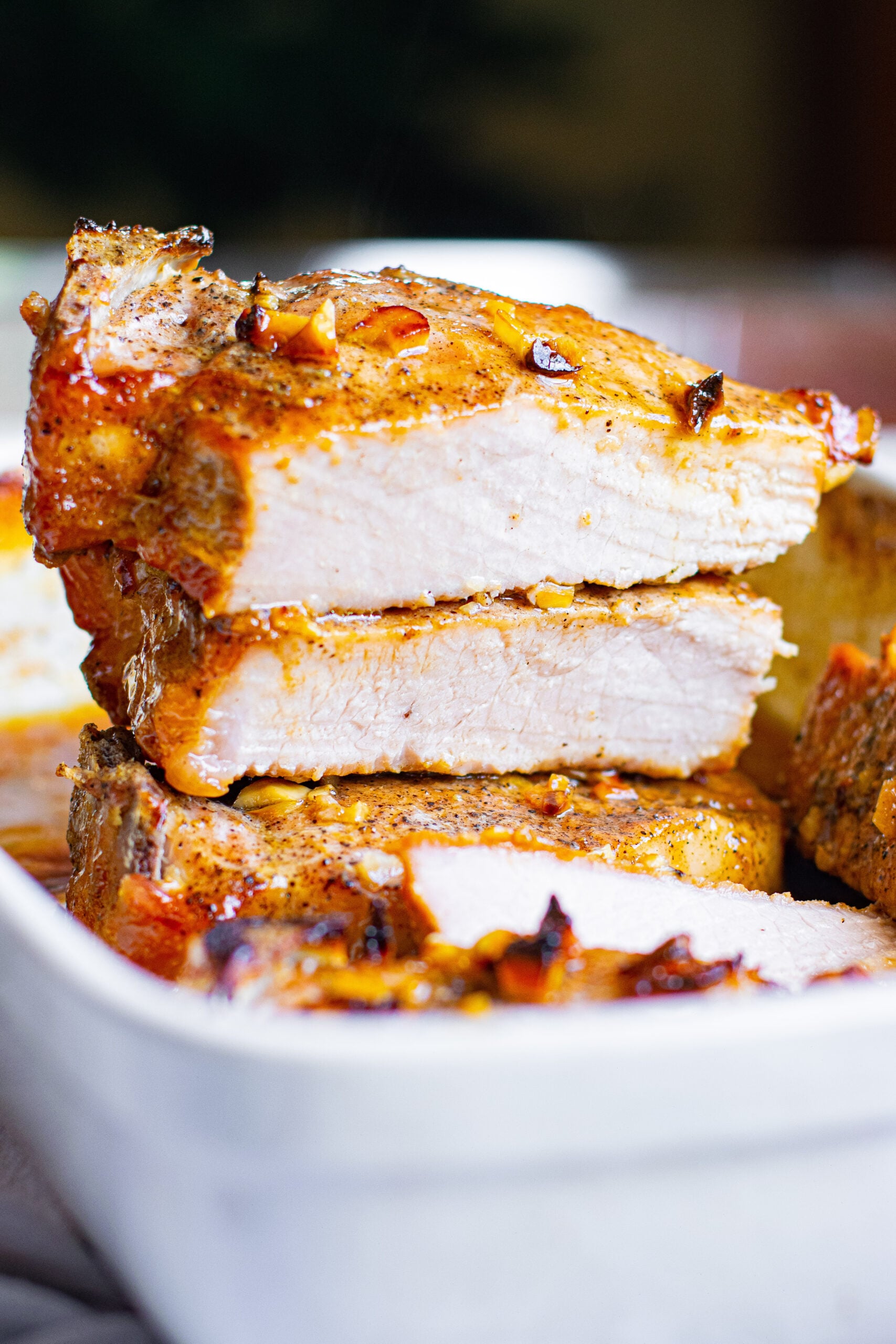 Front view of Honey Garlic Pork Chops halved and stacked.