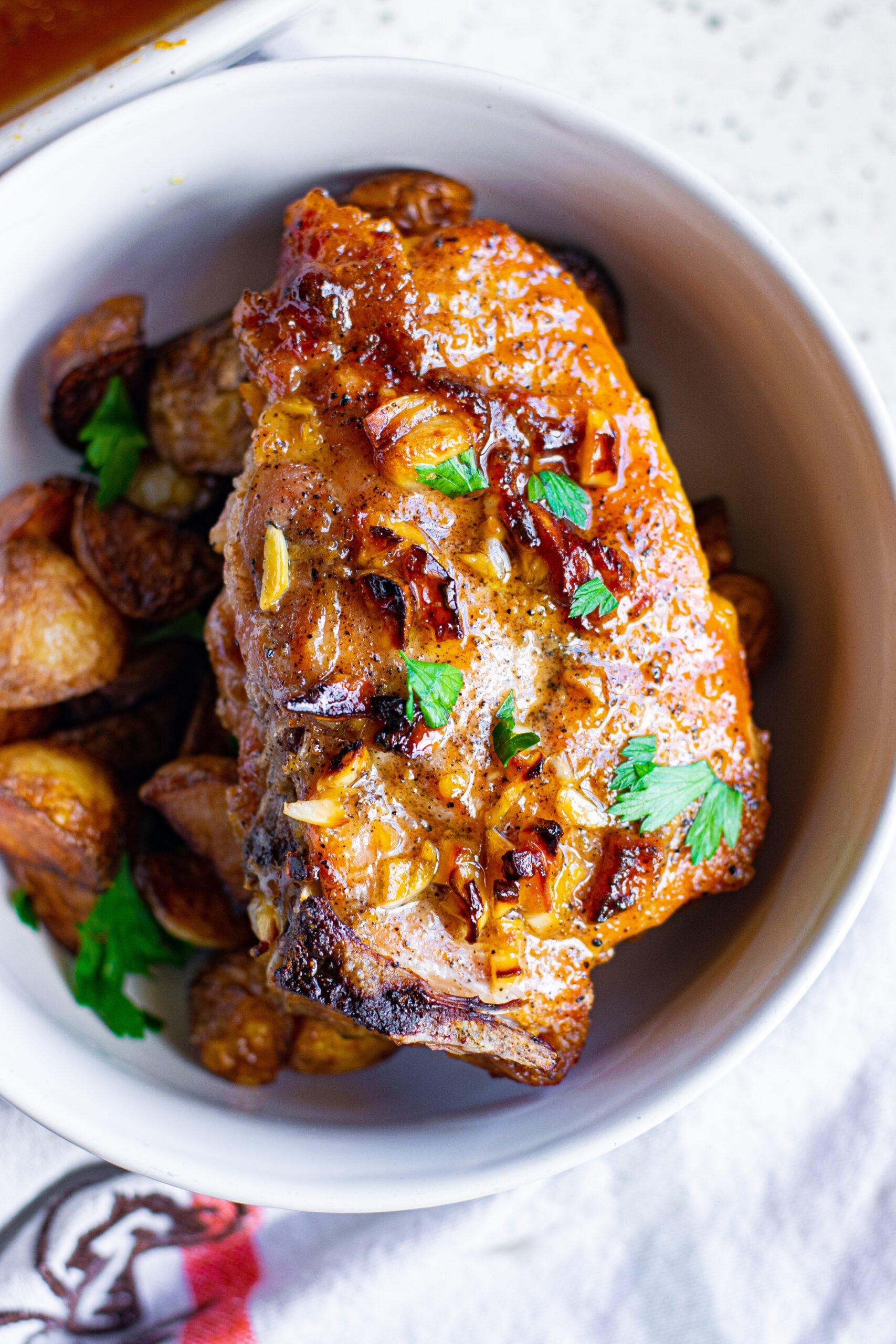 Overhead view of Honey Garlic Pork Chops served over potatoes.