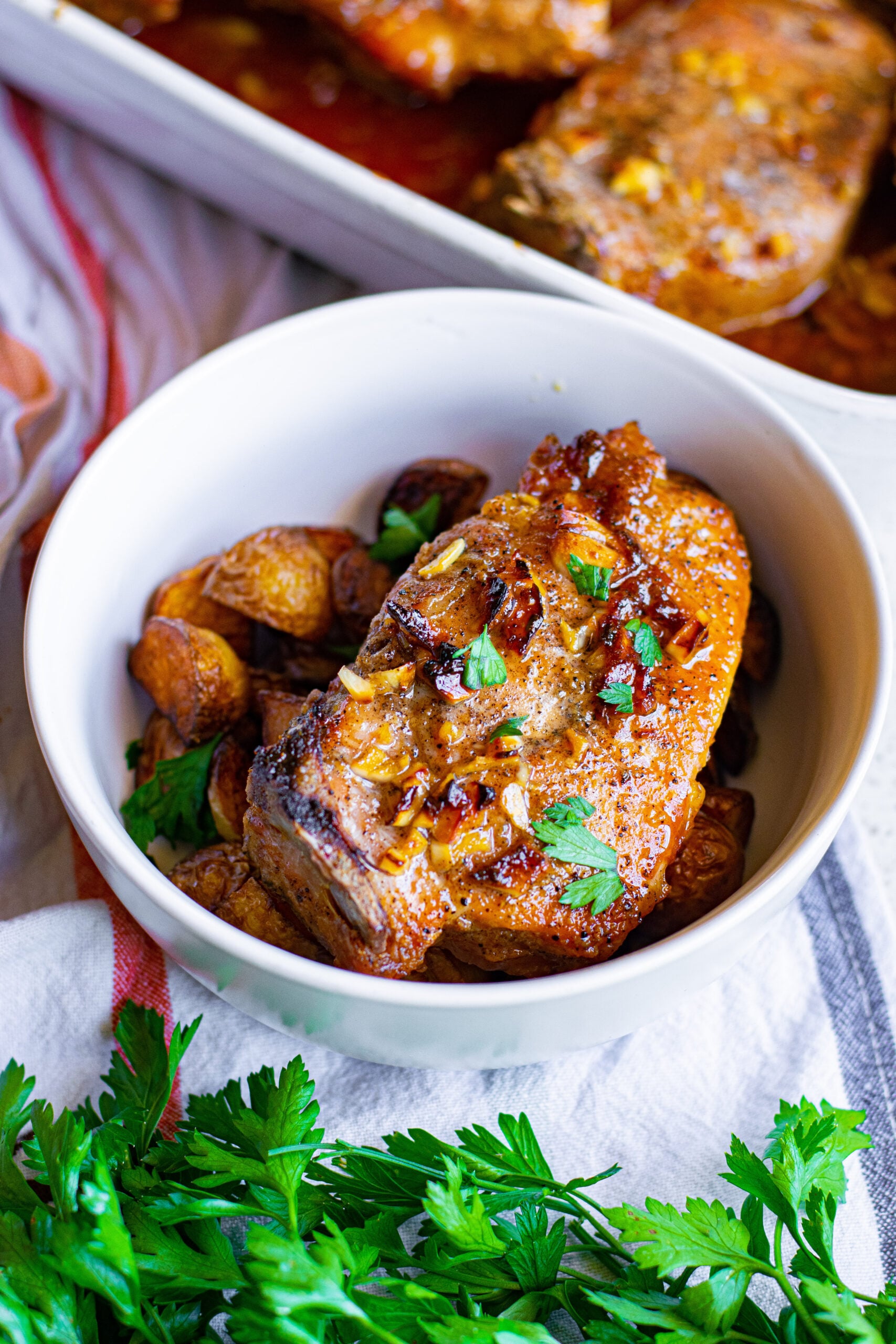 Overhead view of Honey Garlic Pork Chops served over potatoes.