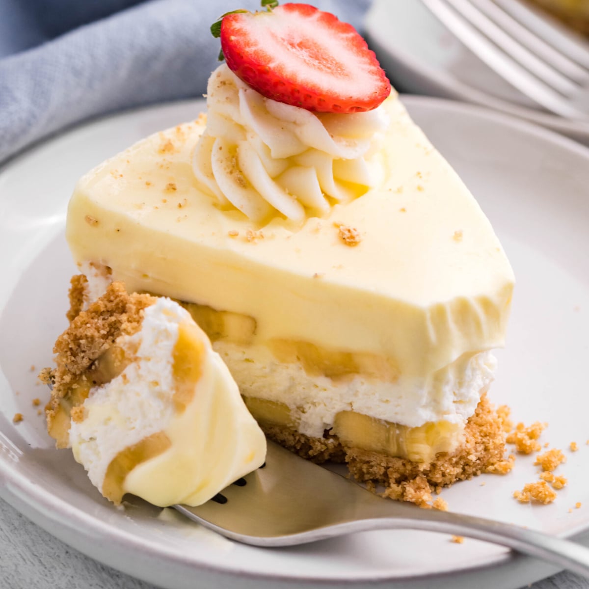 banana pudding cheesecake up close on a white serving plate