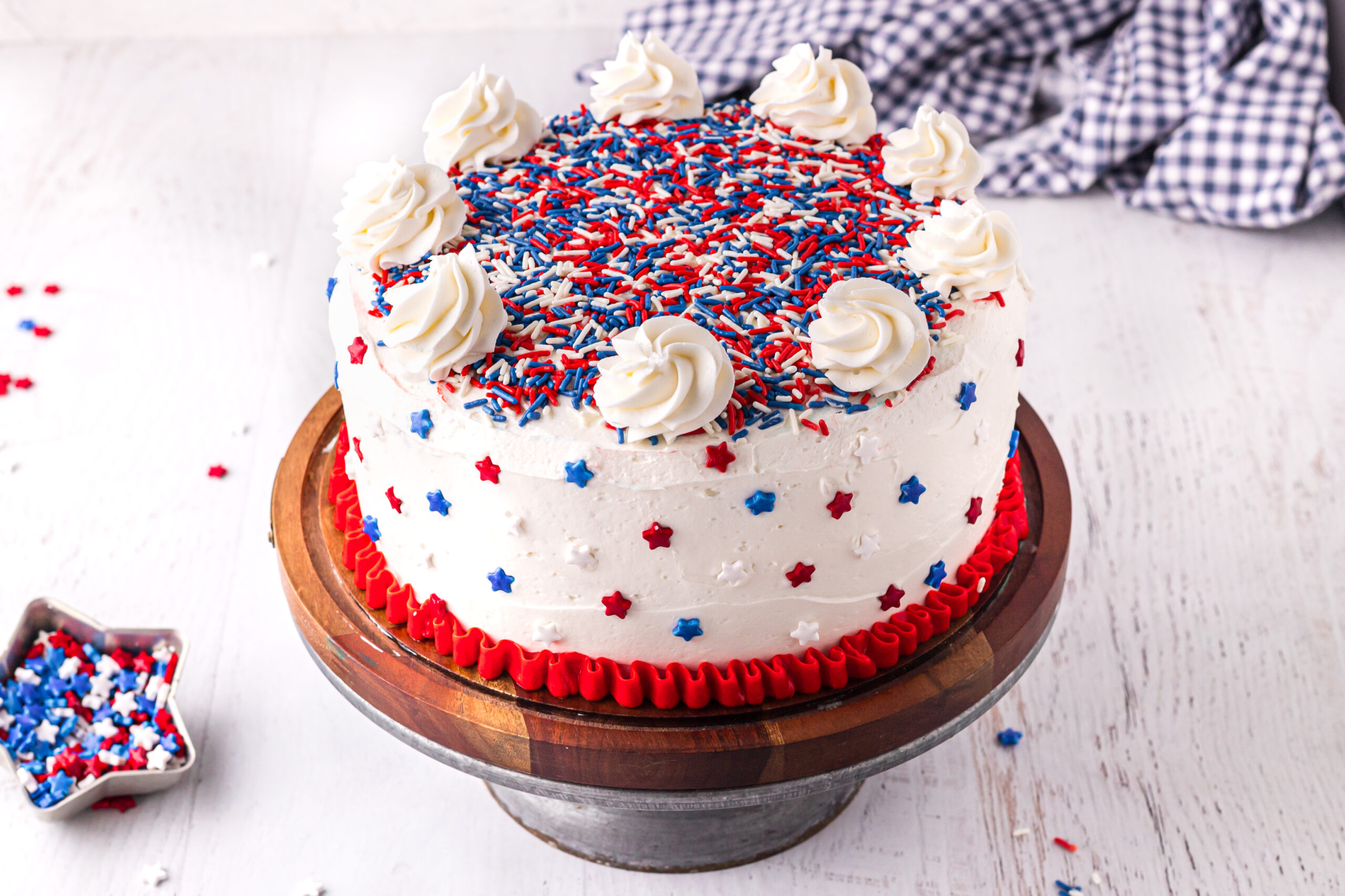 Front view of 4th of July Cake on a wood cake stand.