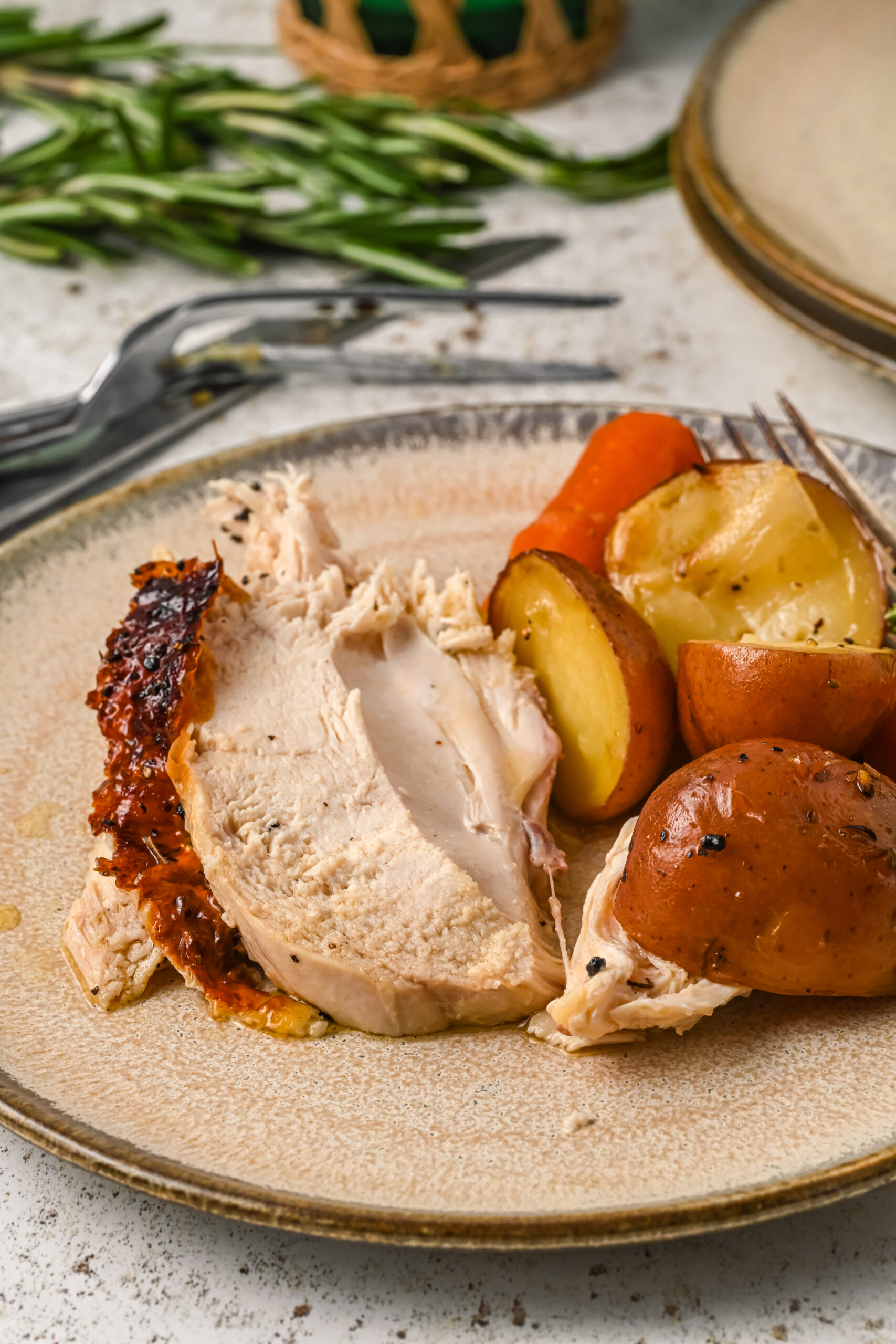 Front view of a serving of Oven Baked Chicken and Vegetables on a plate.
