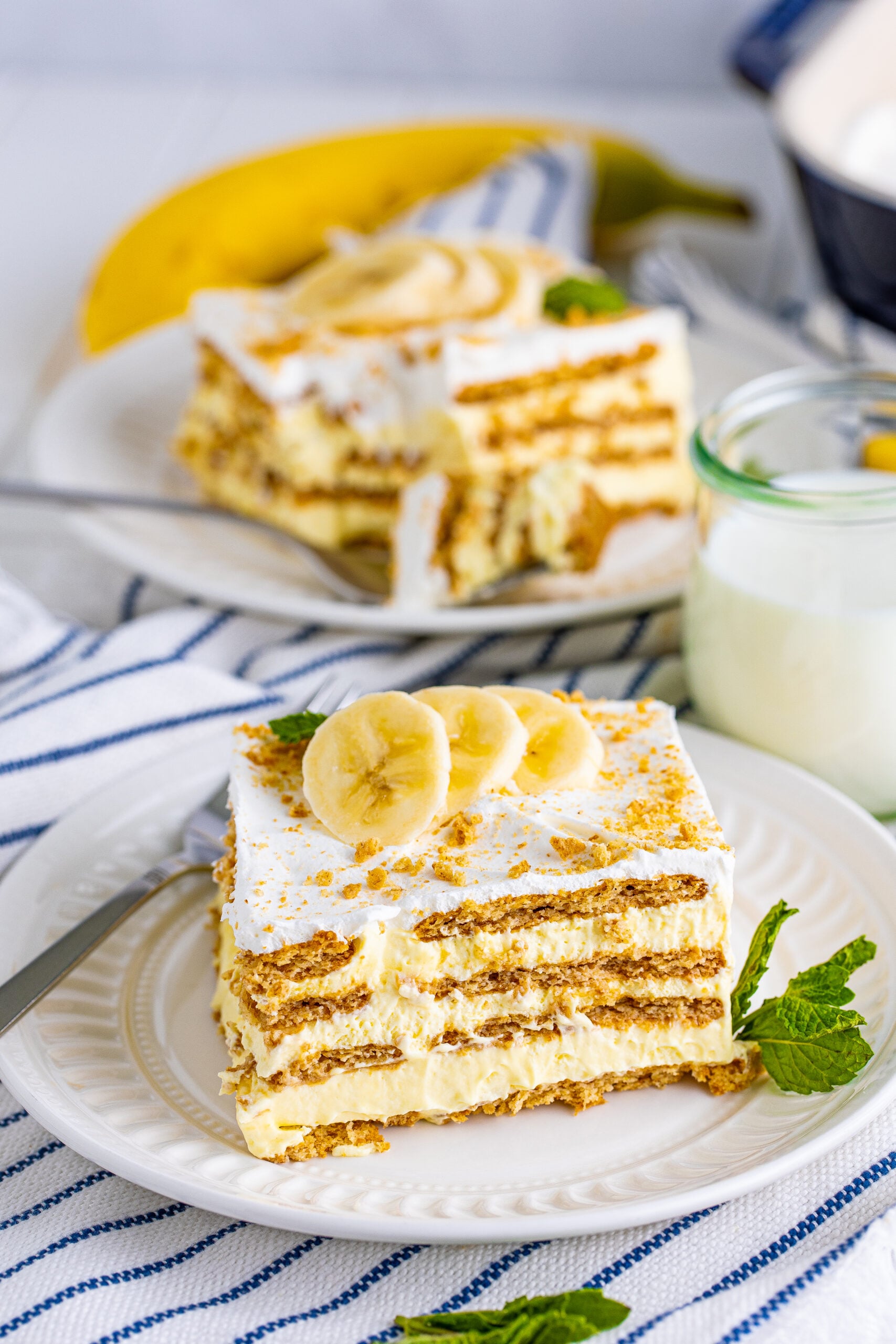 Front view of a slice of Banana Icebox Cake on a white plate.