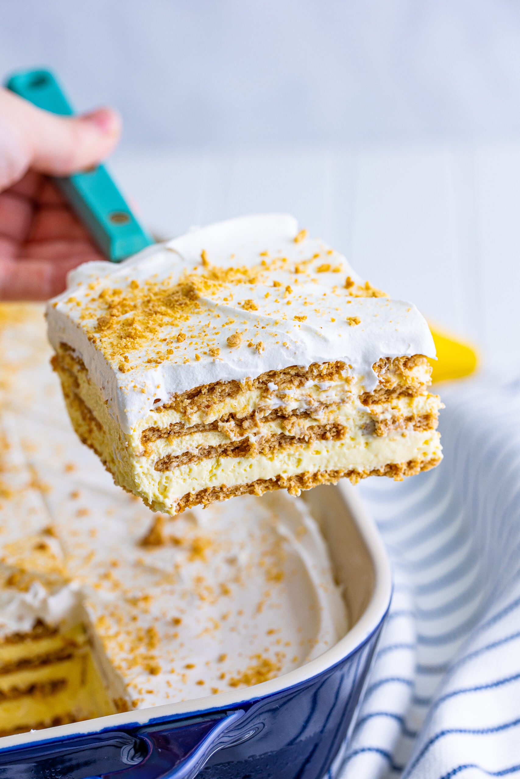 Front view of a slice of Banana Icebox Cake on a spatula.