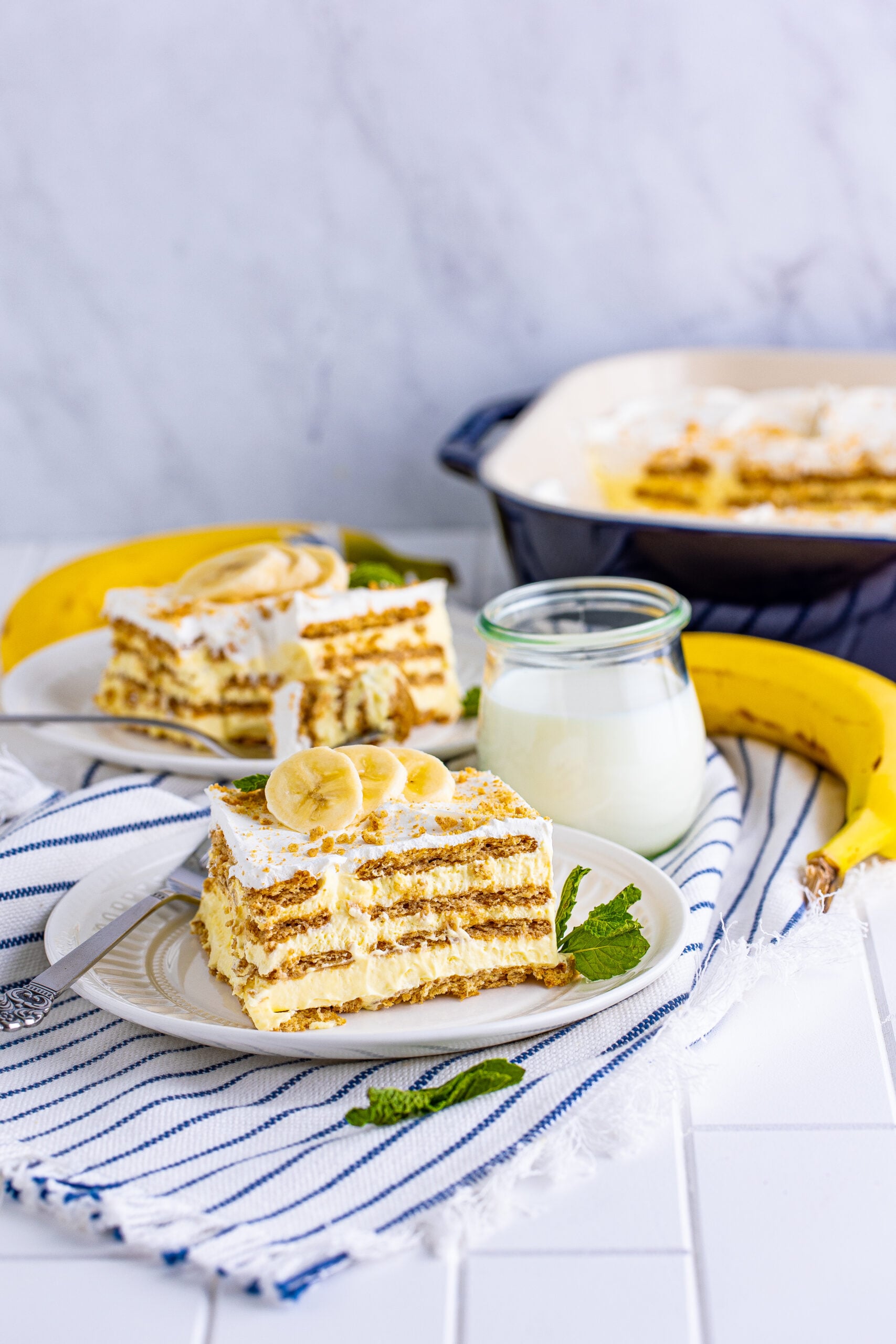 Front view of a slice of Banana Icebox Cake on a white plate.