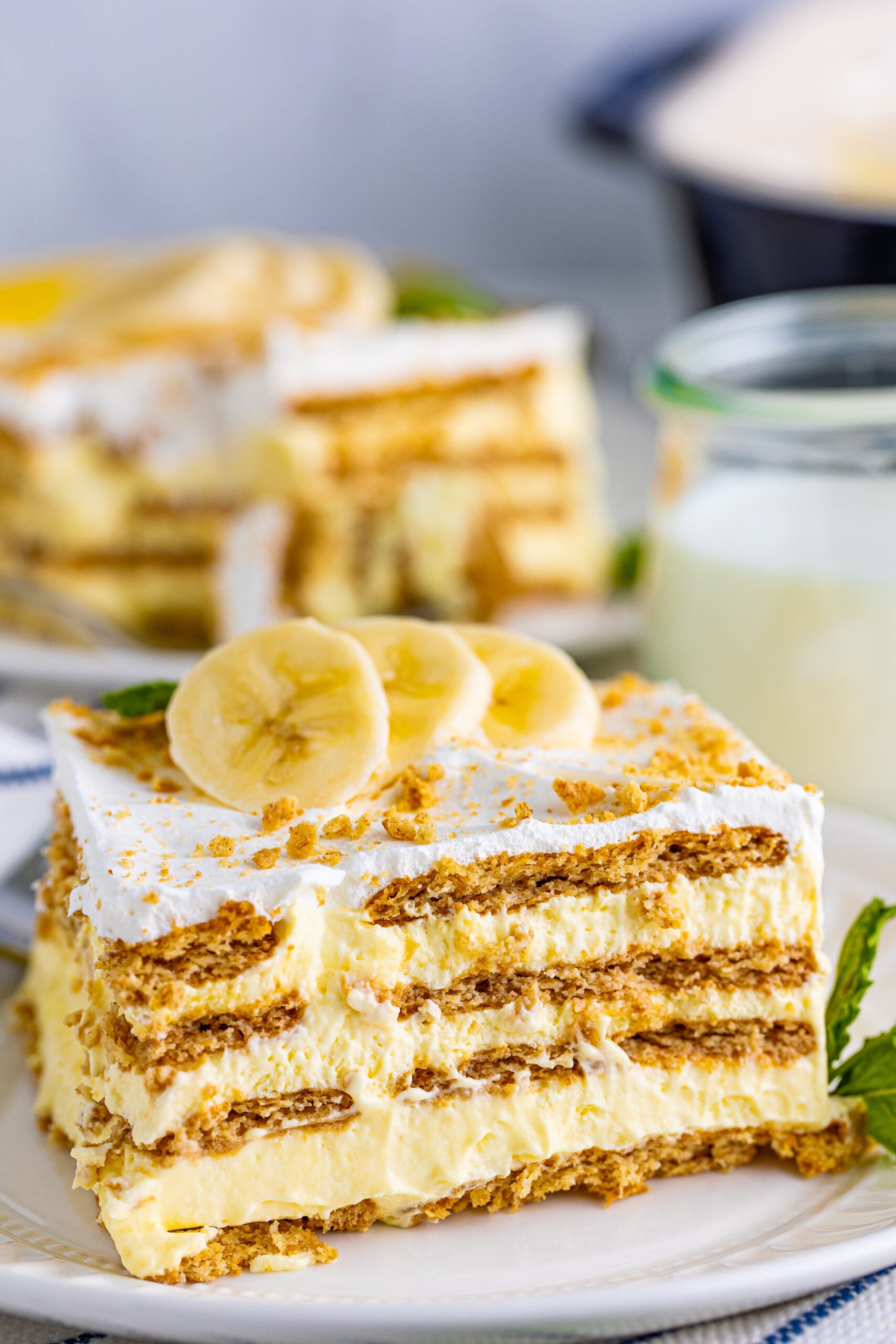 Front view of a slice of Banana Icebox Cake on a white plate.