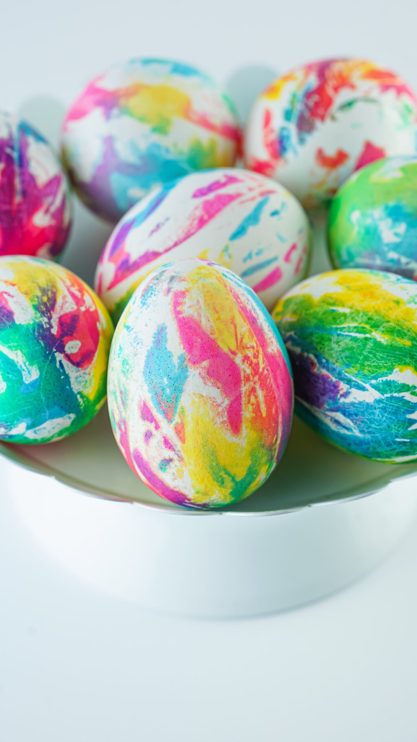 Front view of Tie Dye Easter Eggs on a white stand.
