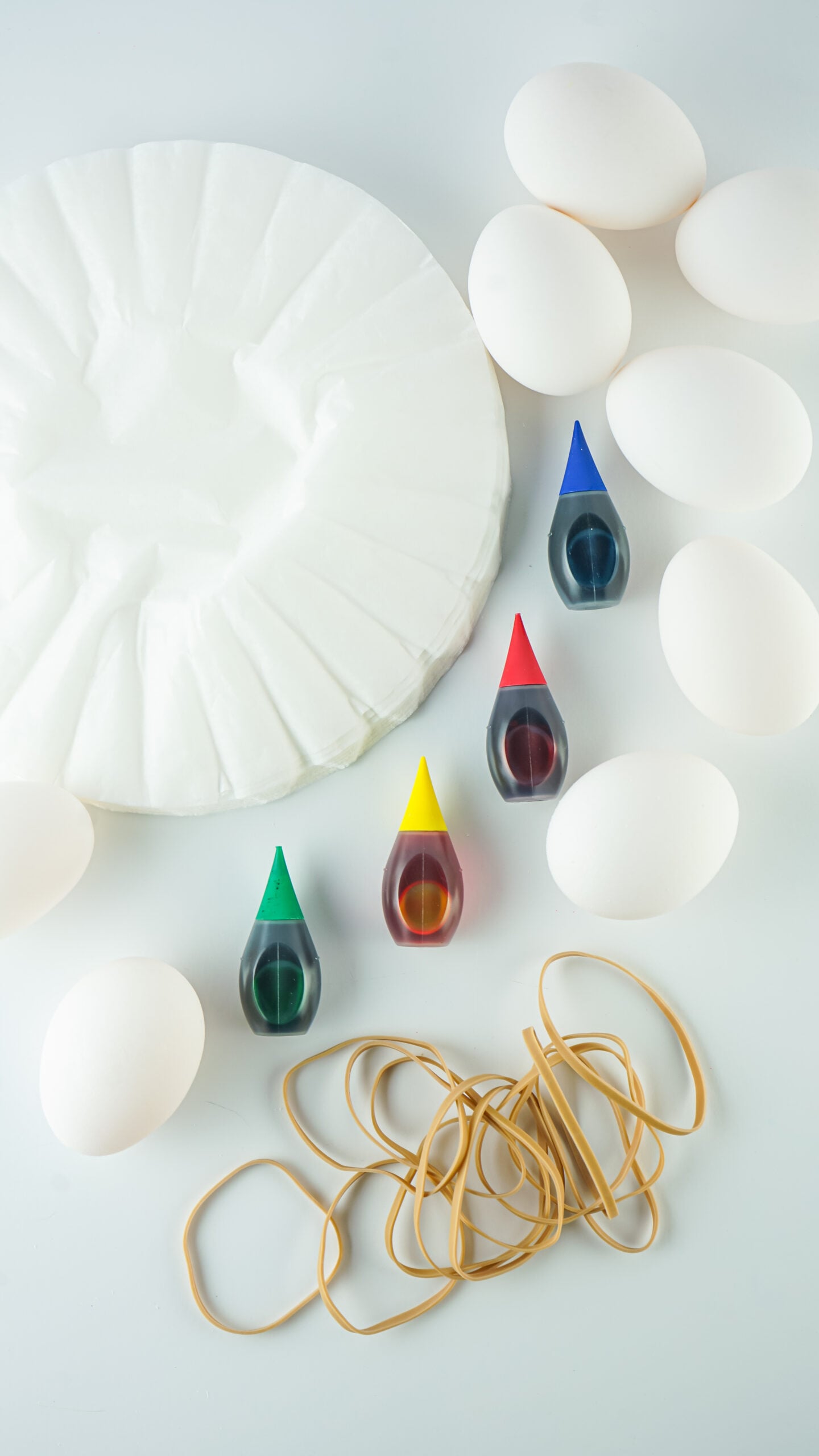 Overhead view of the items needed to make Tie Dye Easter Eggs.