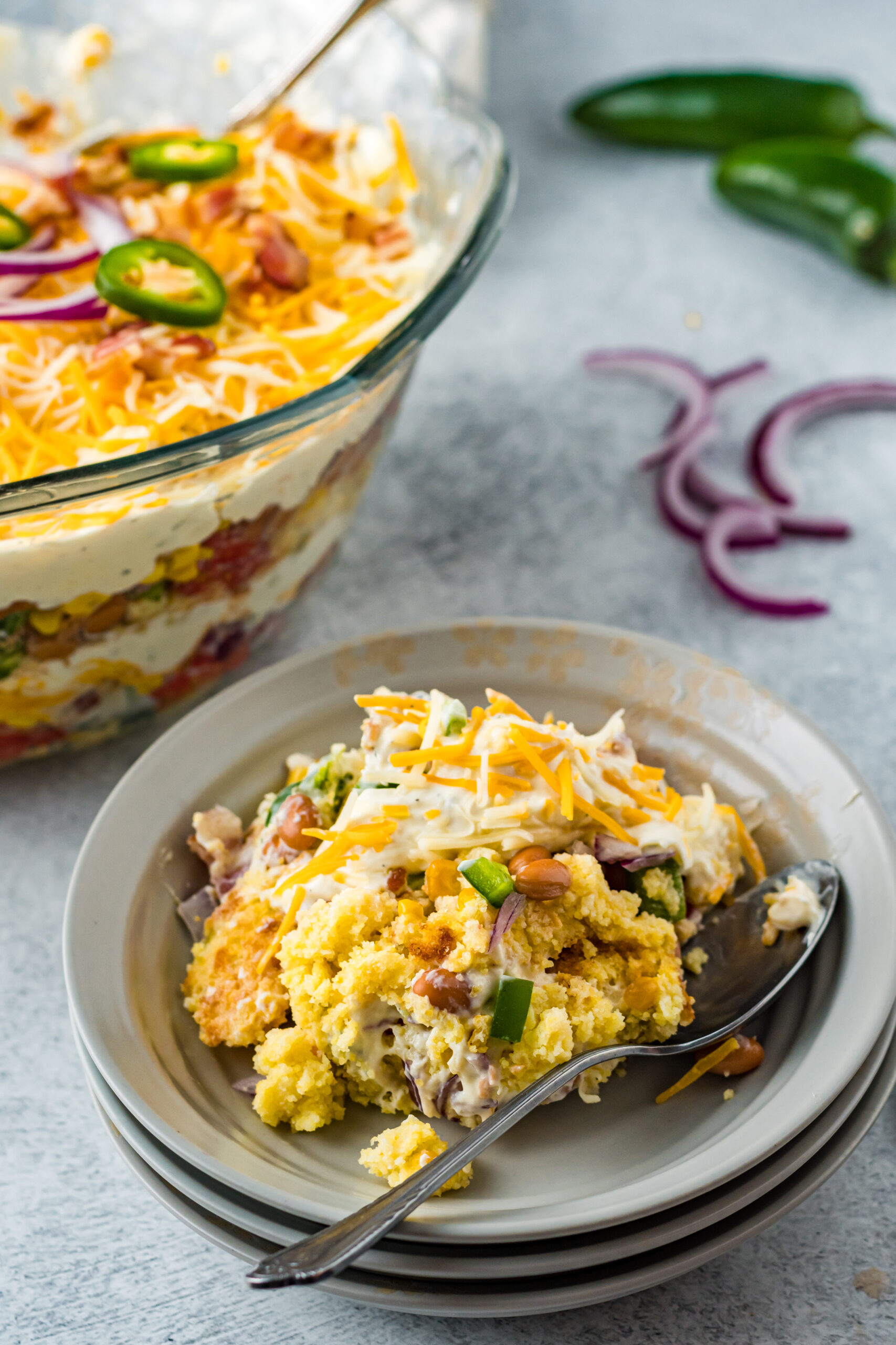 Front view of a serving of Cornbread Salad in a gray bowl.