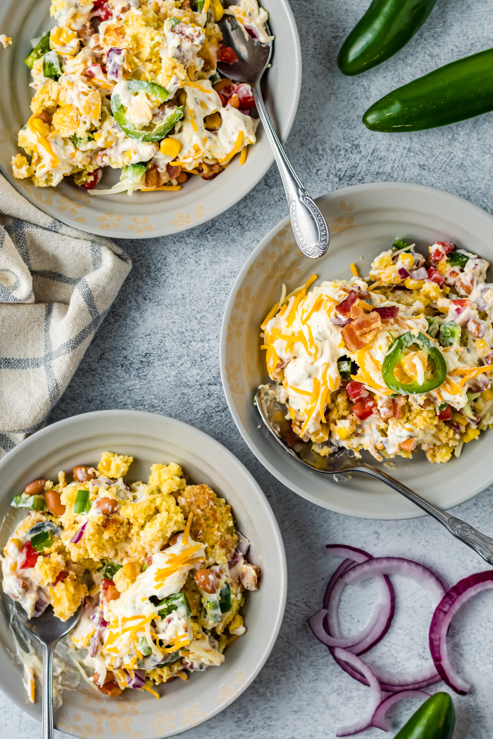 Overhead view of a serving of Cornbread Salad in a gray bowl.