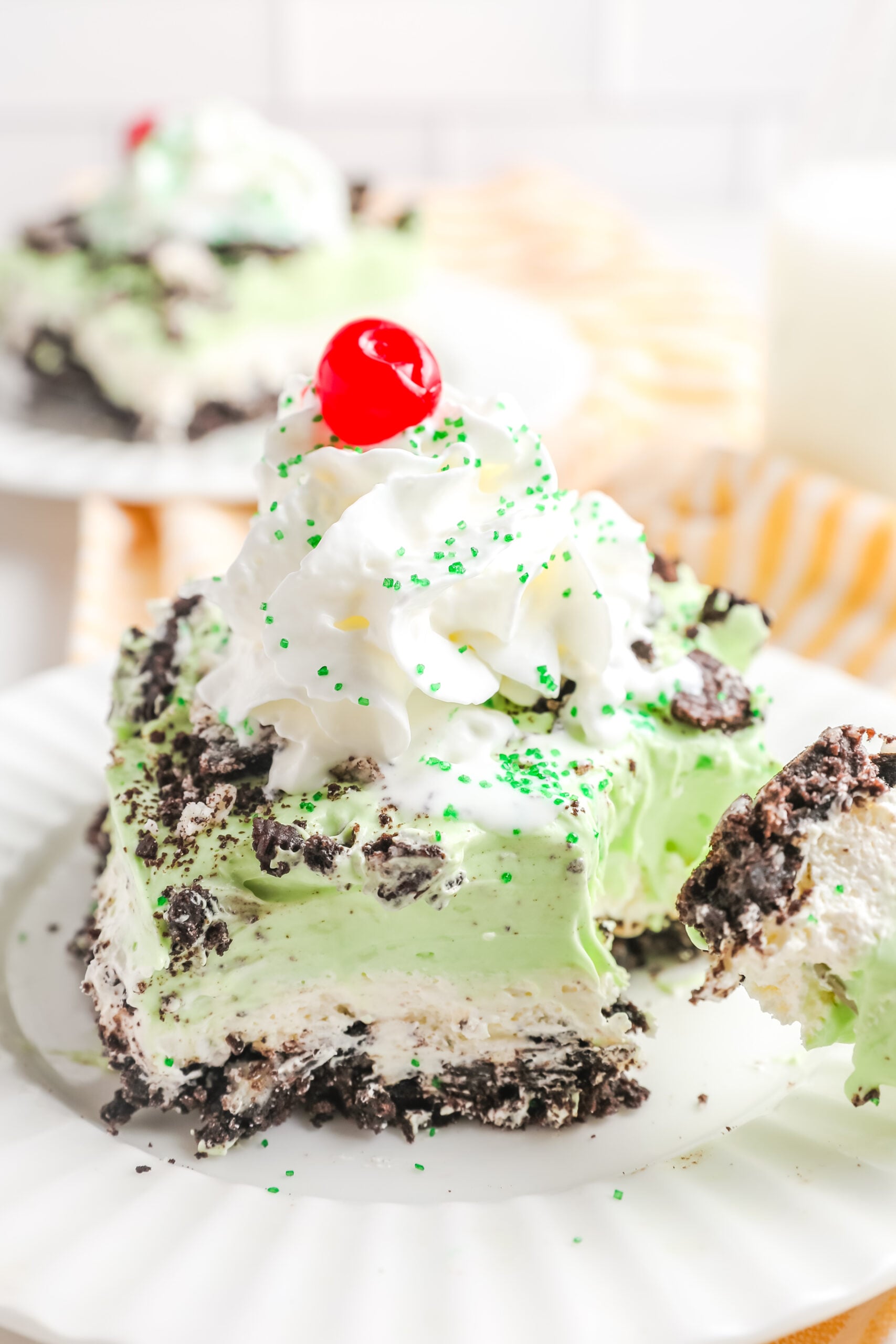 Up close view of a bite being removed from a piece of shamrock lasagna.