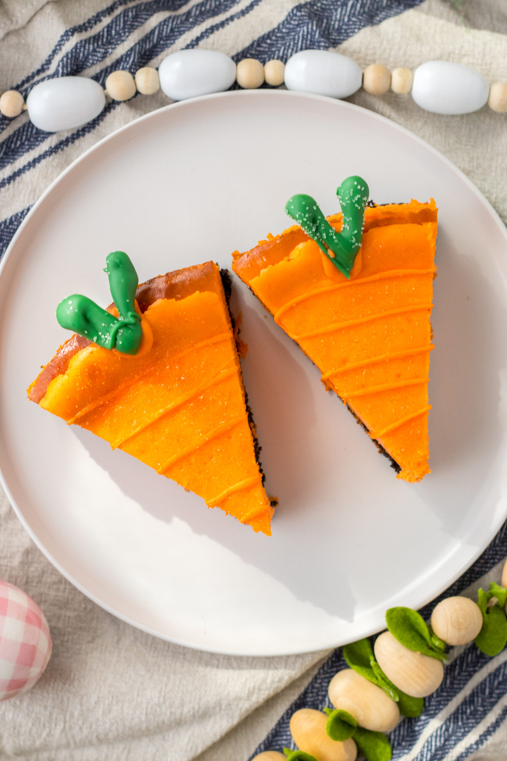 Overhead view of two Cheesecake Carrots on a white plate.