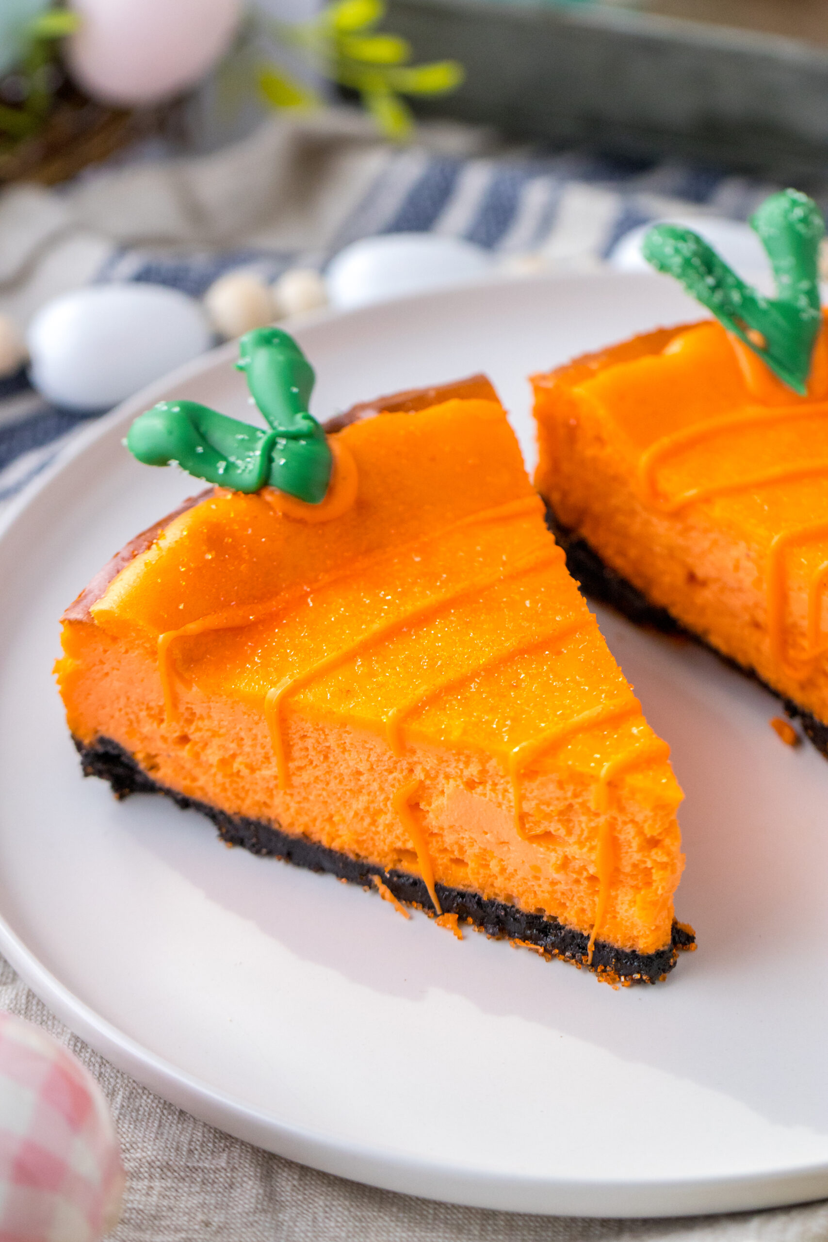 Two Cheesecake Carrots on a white plate.