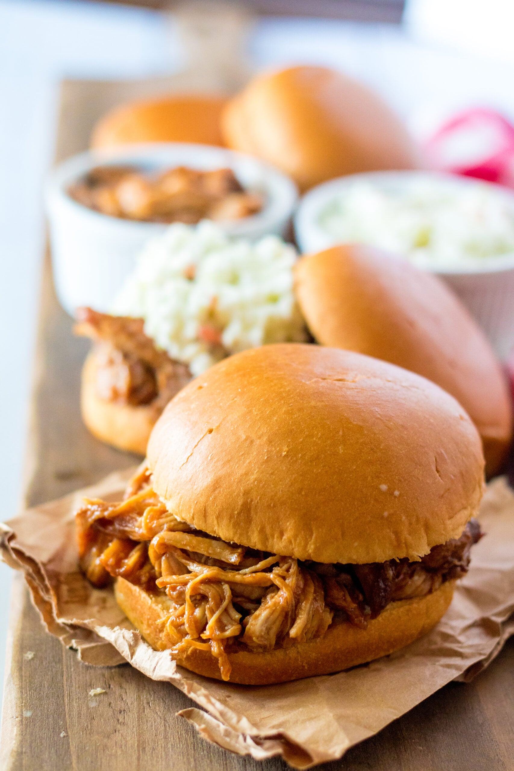 Front view of Slow Cooker Cola Pulled Pork on a bun.
