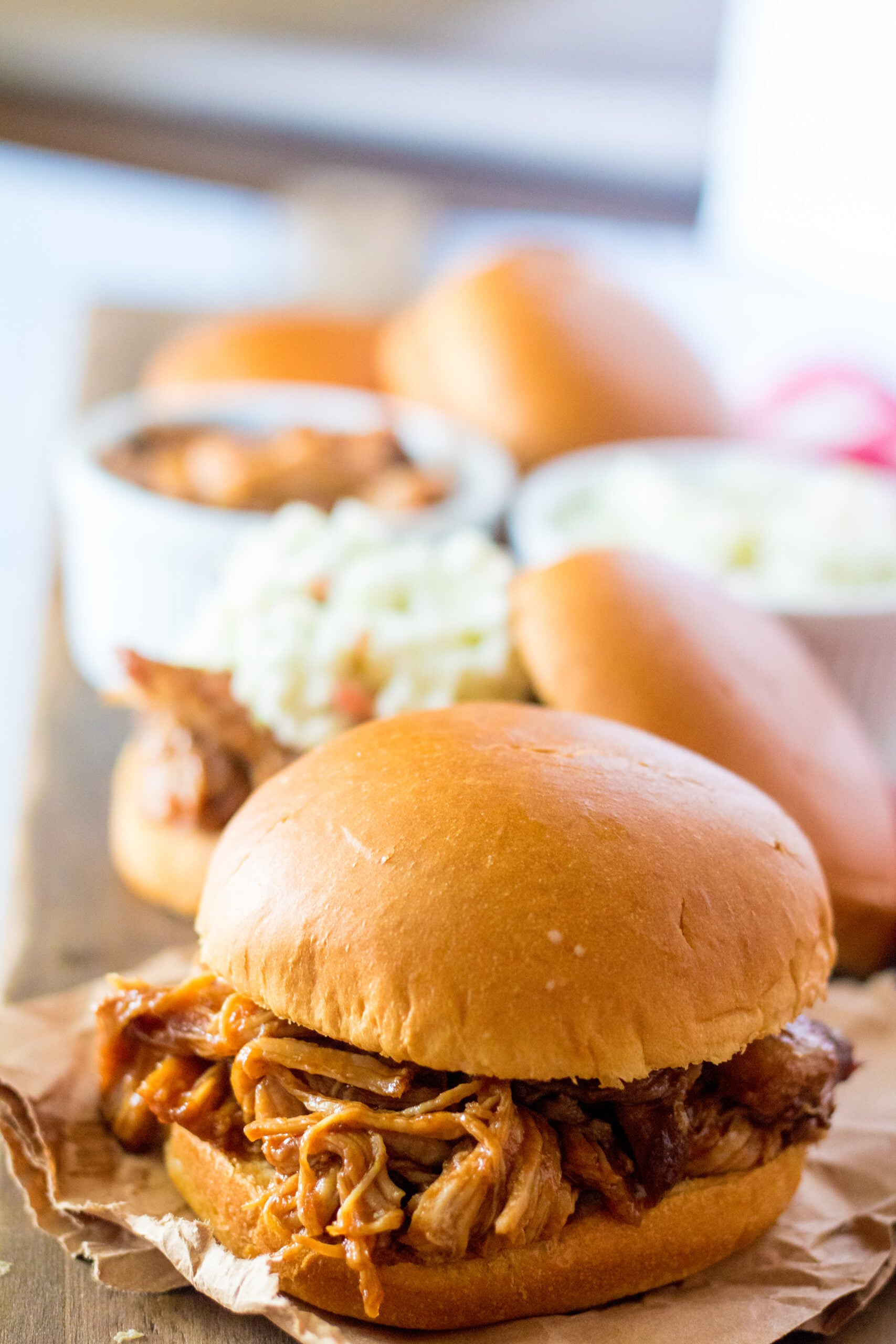 Front view of Slow Cooker Cola Pulled Pork on a bun.