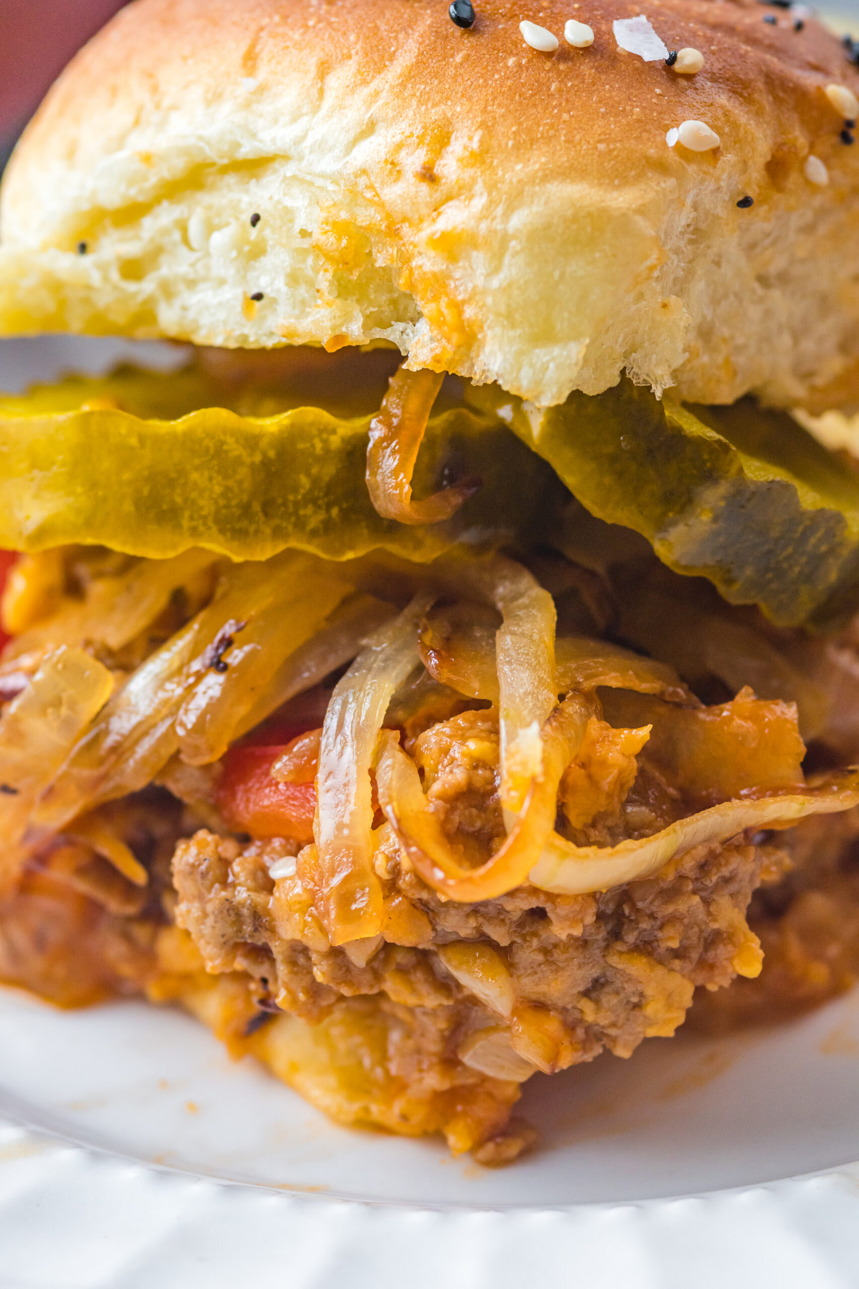 Close up view of a Cheesy Chicken Sloppy Joe Slider.