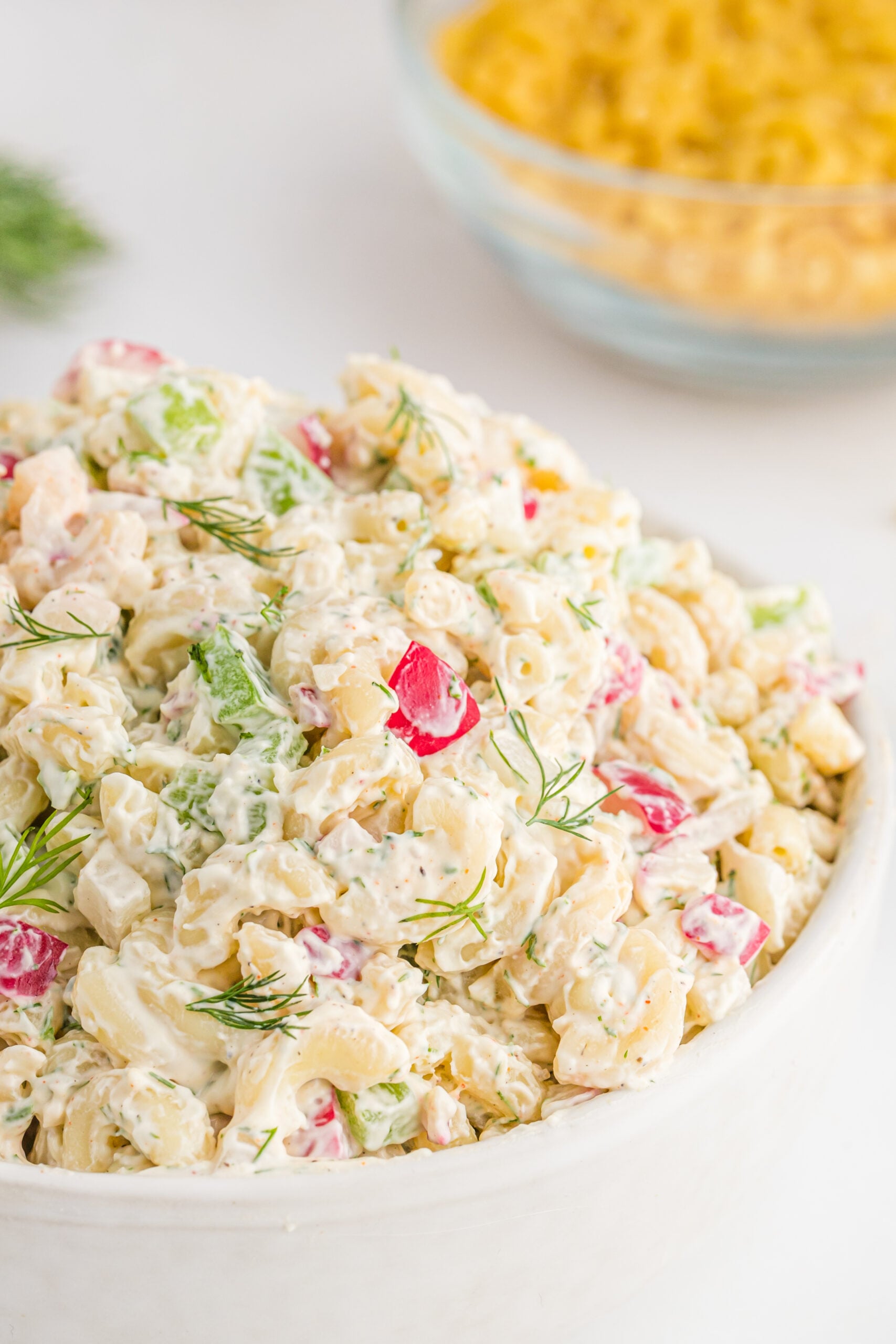 Front view of Macaroni Dill Pasta Salad in a white serving bowl.