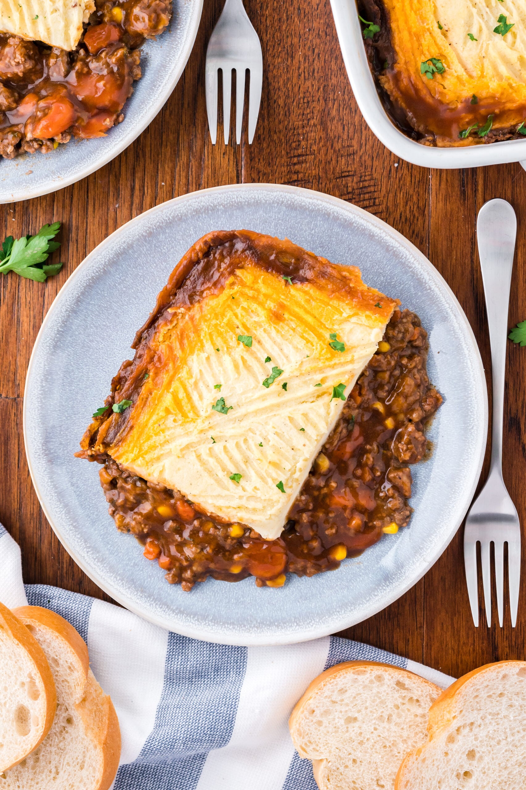 Overhead shot of Shepherd's Pie on a gray and white plate.