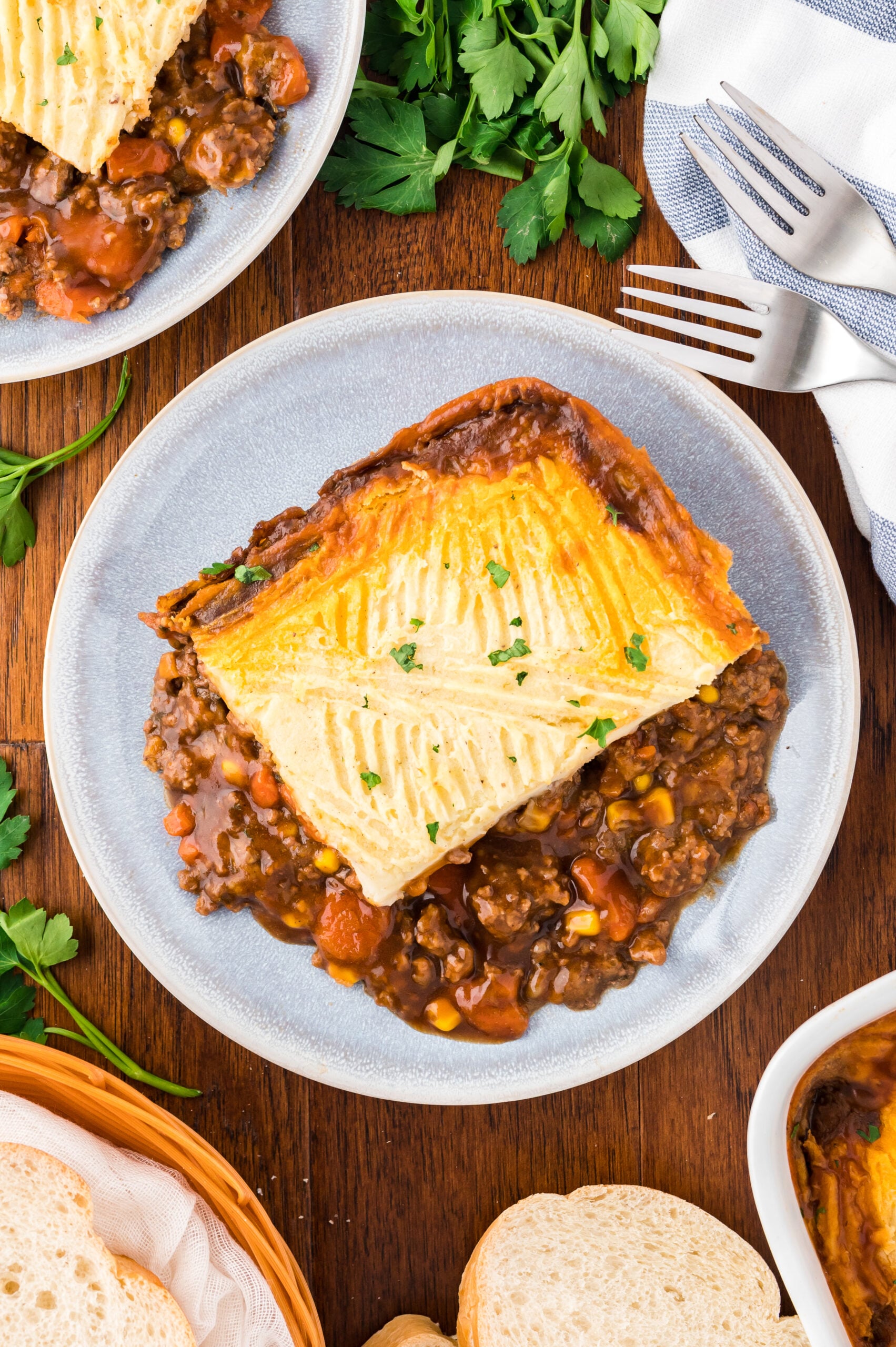 Overhead shot of Shepherd's Pie on a gray and white plate.