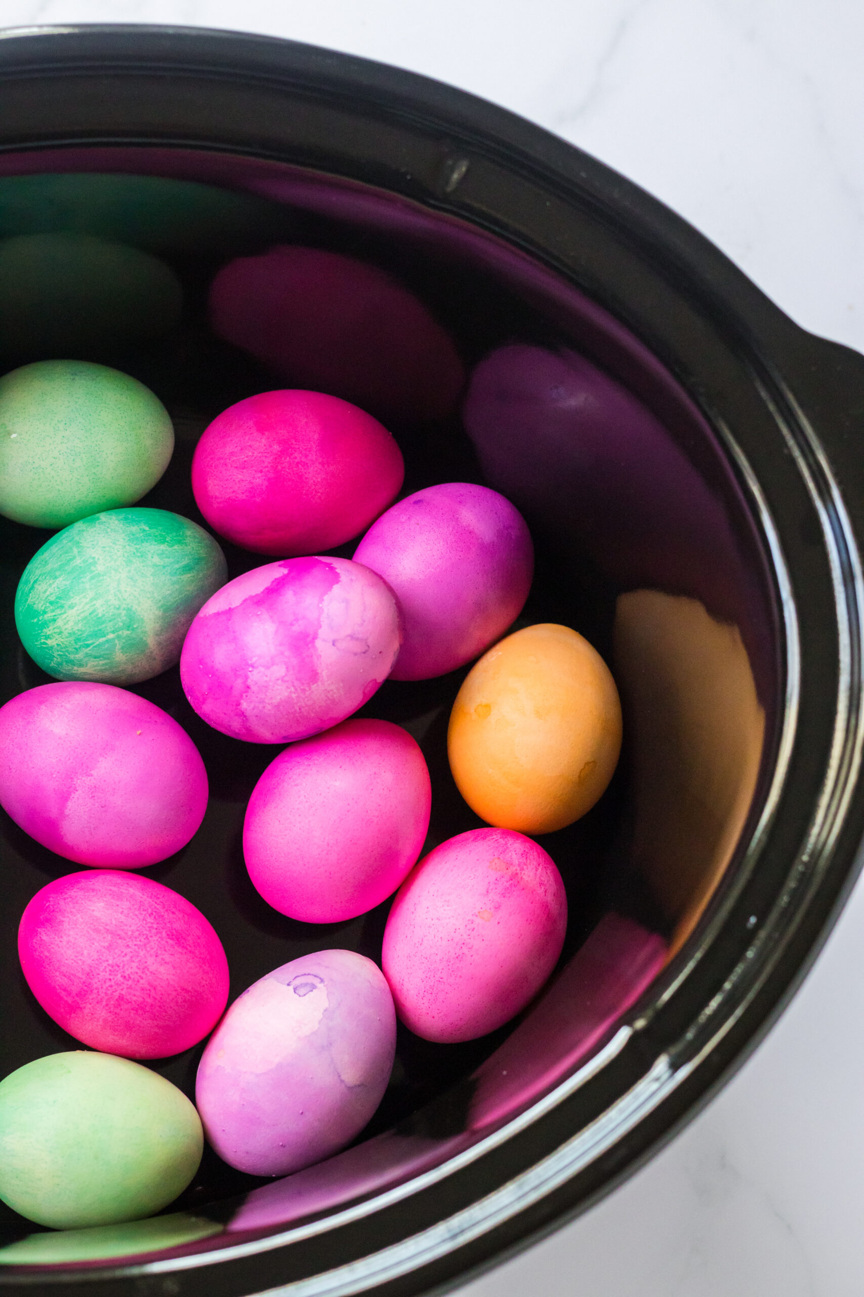 Slow Cooker Dyed Easter Eggs in a slow cooker pot.