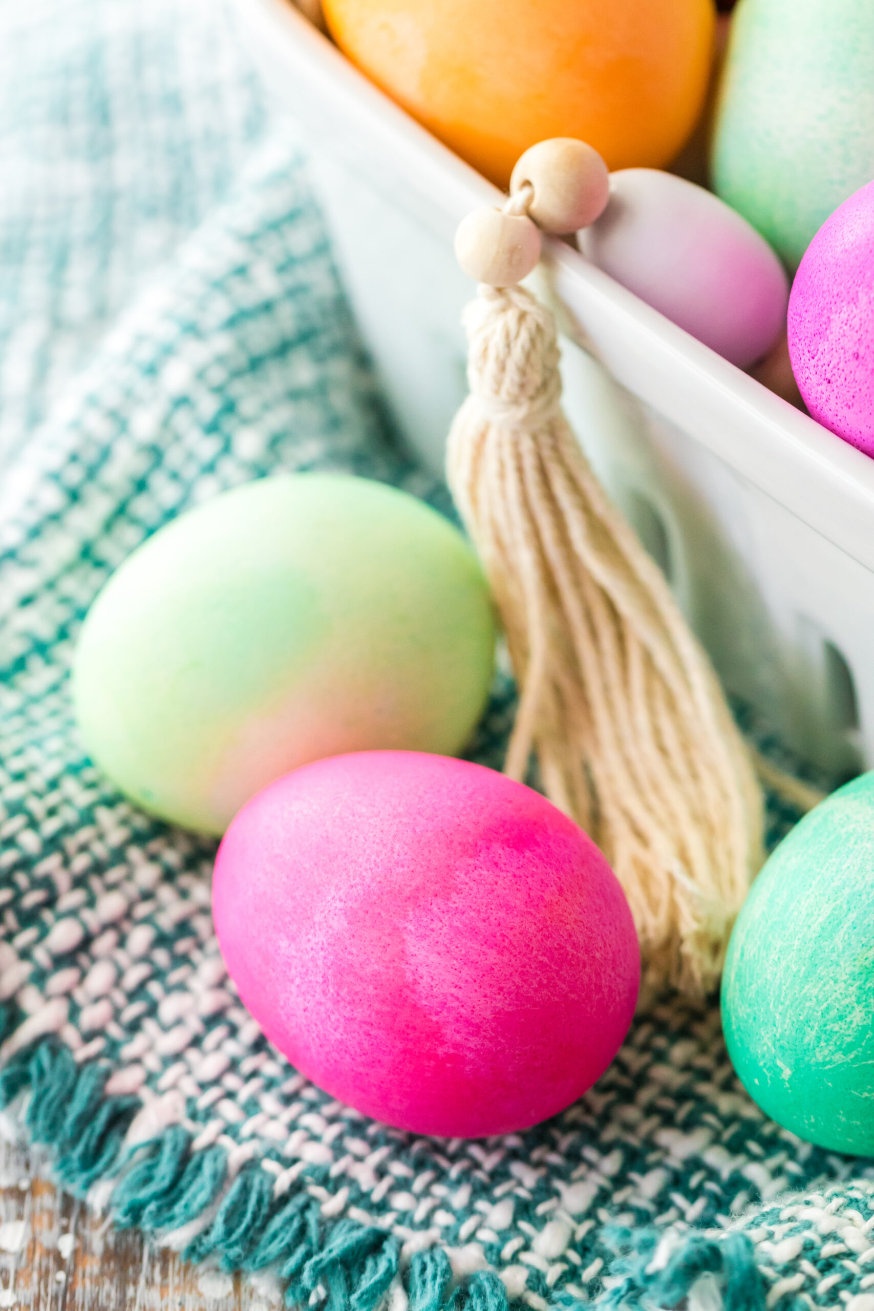 Close up view of a pink slower cooker dyed Easter egg.